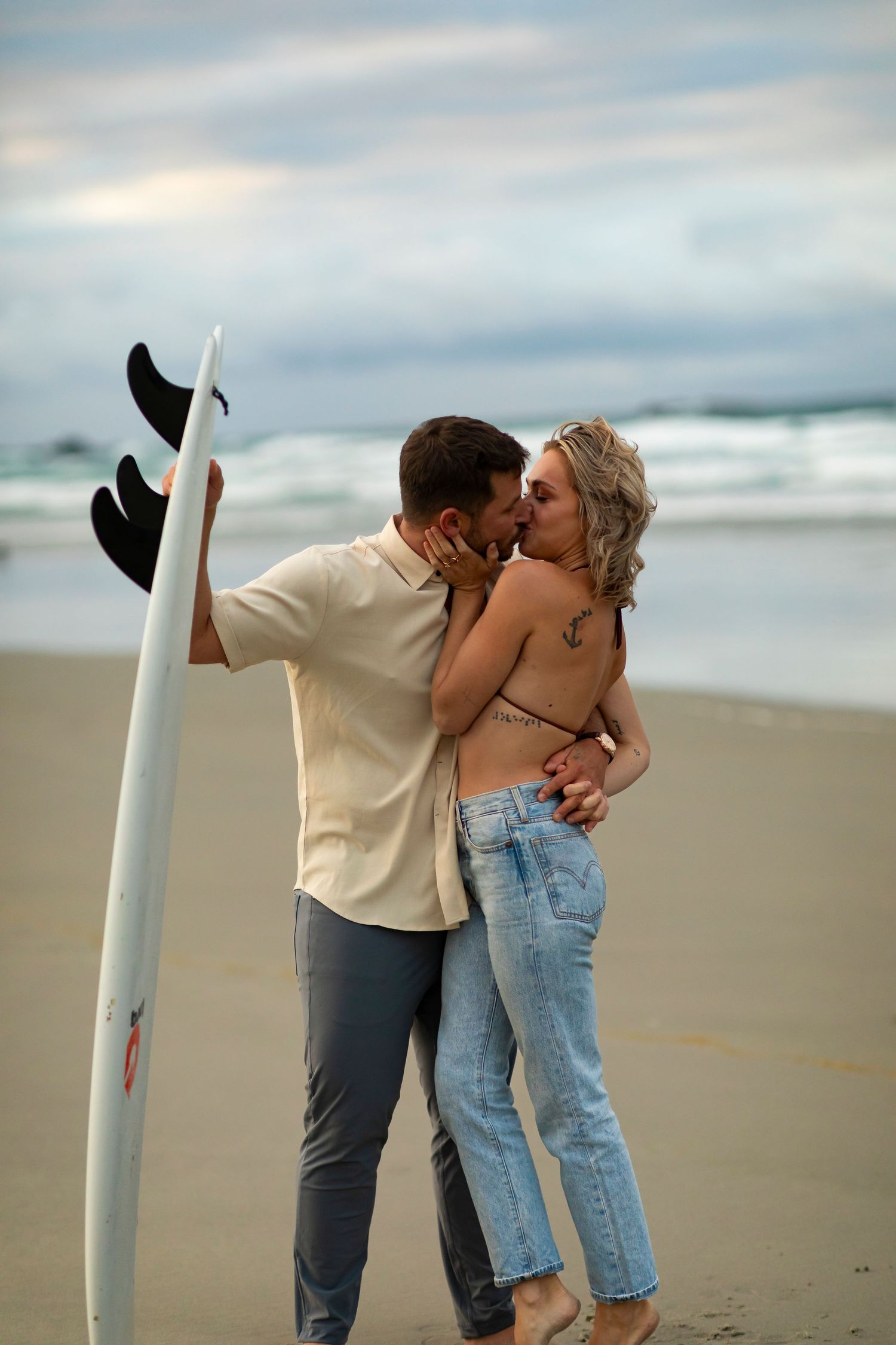 destination photoshoot of beach engagement new zealand couple steamy make out sesh