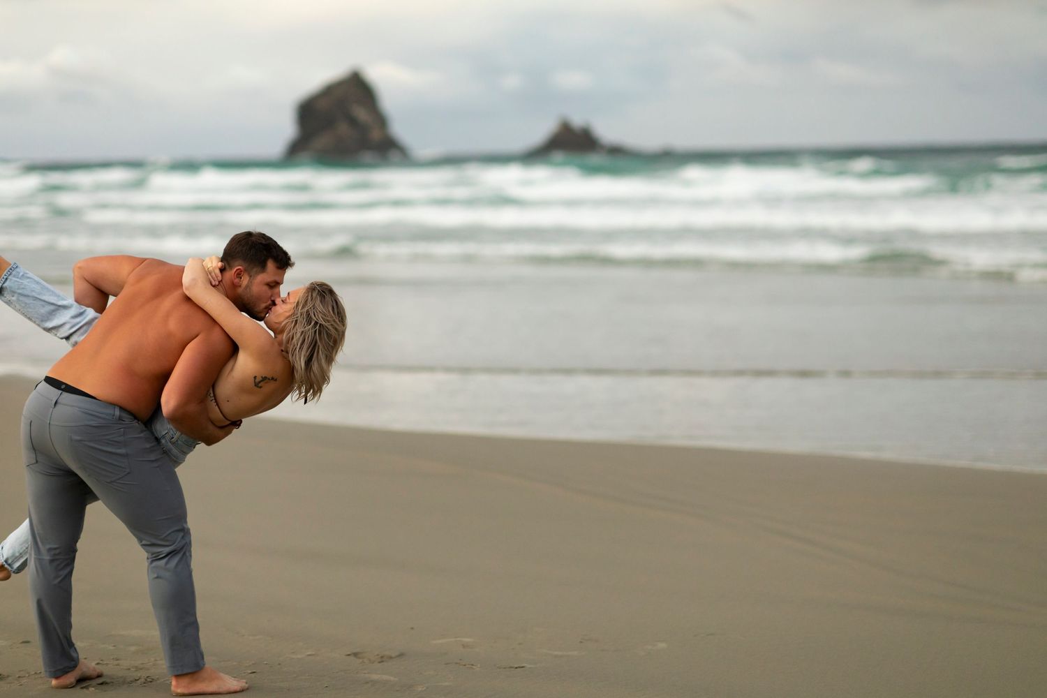 destination photoshoot of beach engagement new zealand couple steamy make out sesh