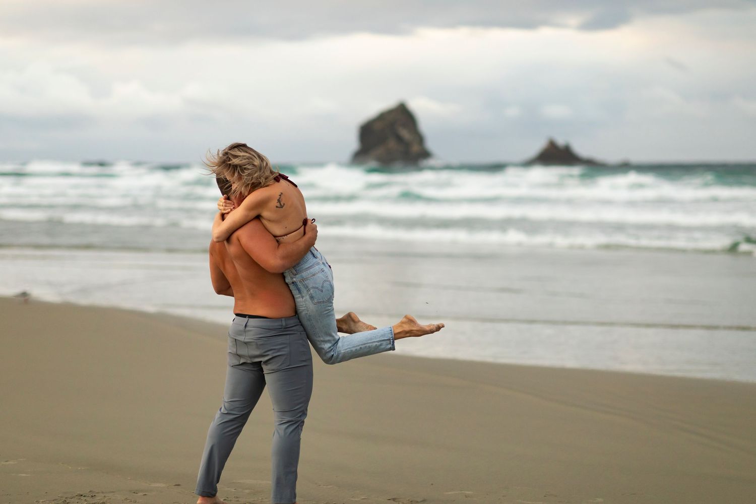 destination photoshoot of beach engagement new zealand couple steamy make out sesh