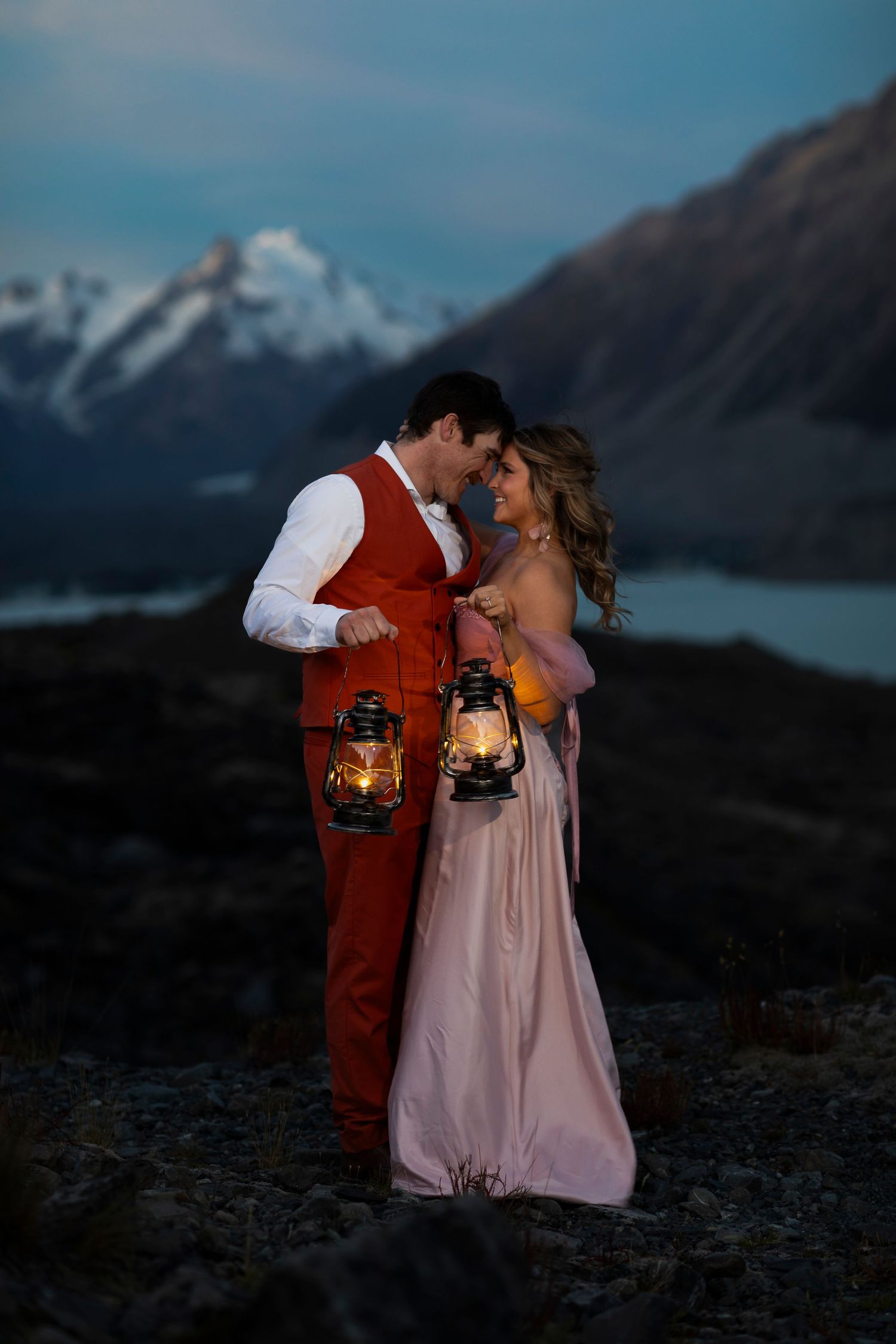mountain top couple with lanterns destination photography