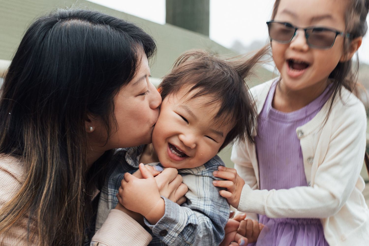 A collage of candid family moments showing affectionate interactions between parent and child in casual settings.
