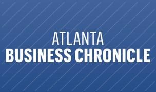 Blue banner with white text displaying Atlanta Business Chronicle logo against a dark background.