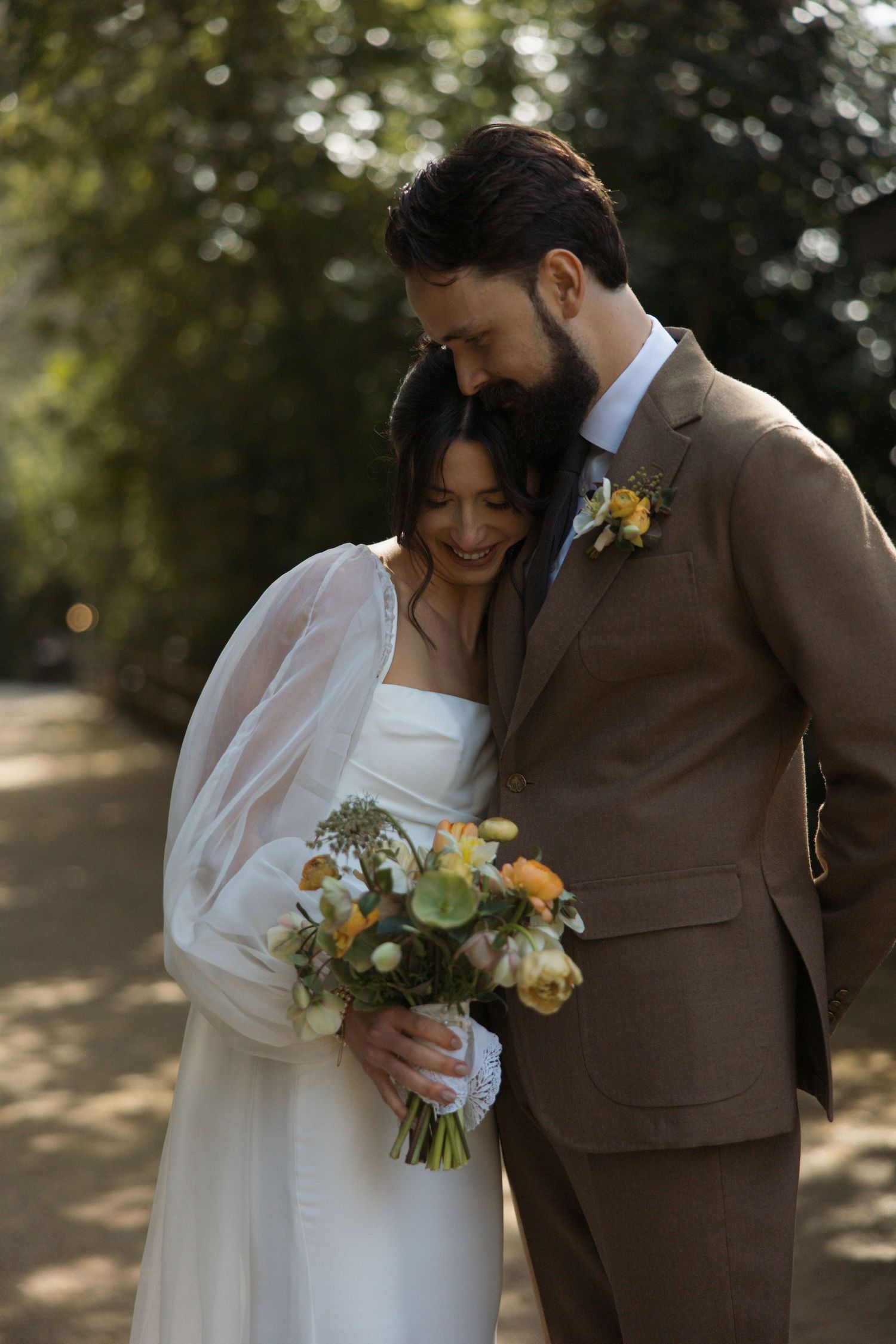 Bride and groom hugging during a candid wedding moment