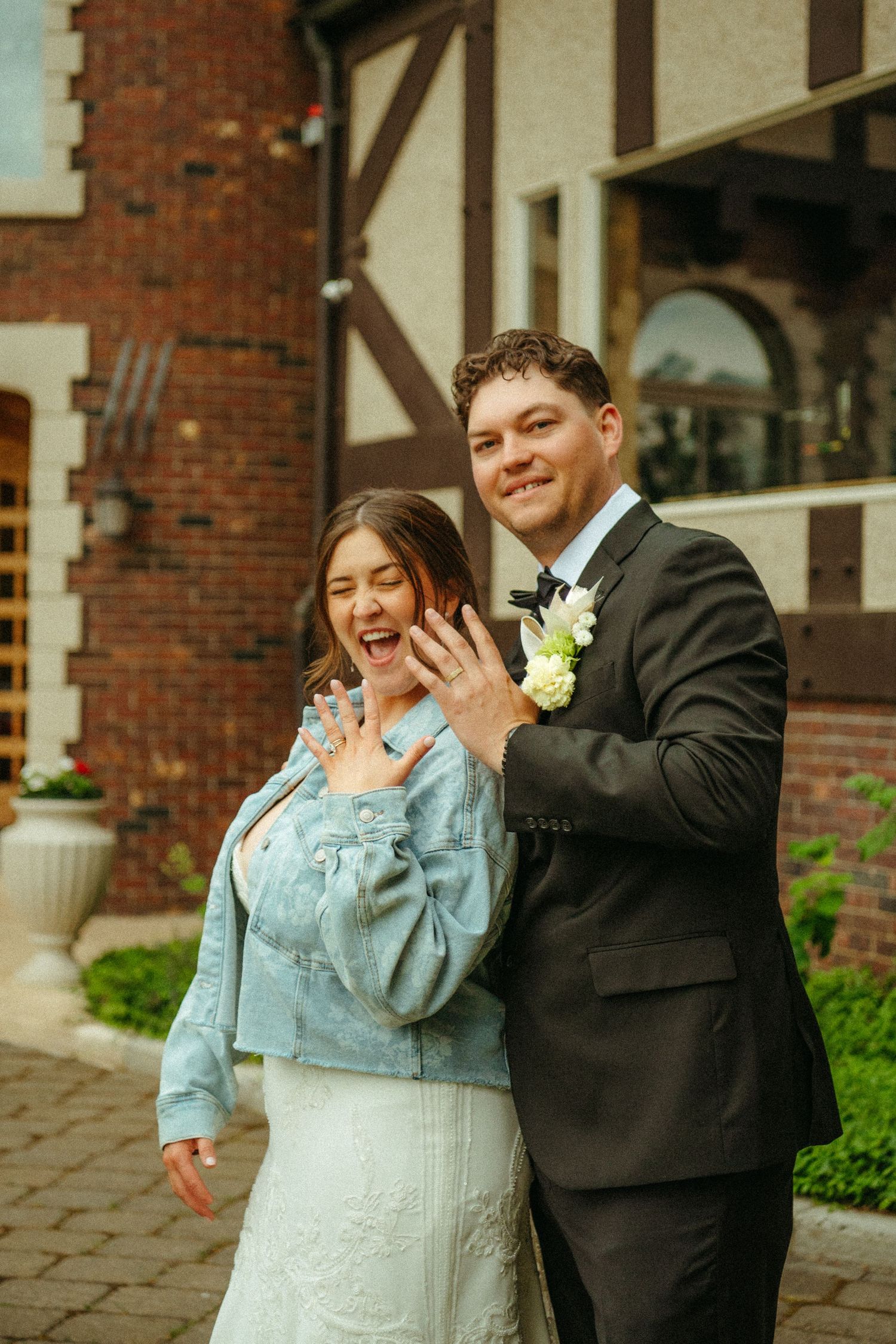 A joyful couple shares candid laughter together in a series of photos outside a brick building.
