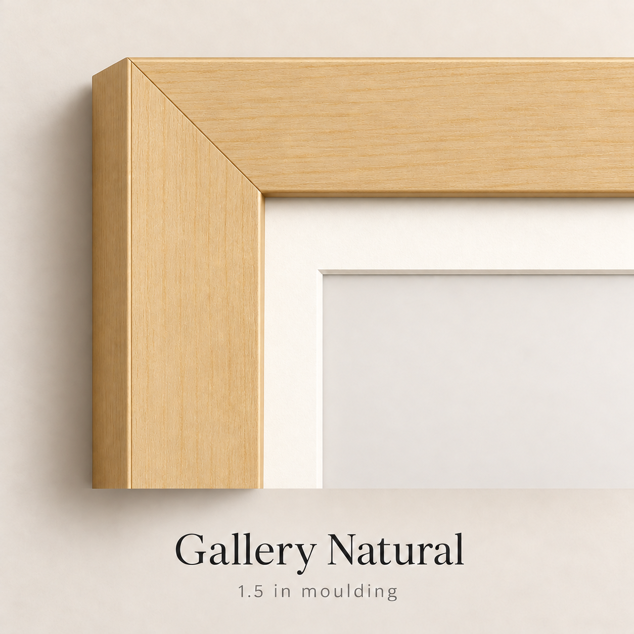 Corner of a Gallery Natural picture frame with 1.5 inch moulding, a mitered light wood finish and white mat on a neutral wall.