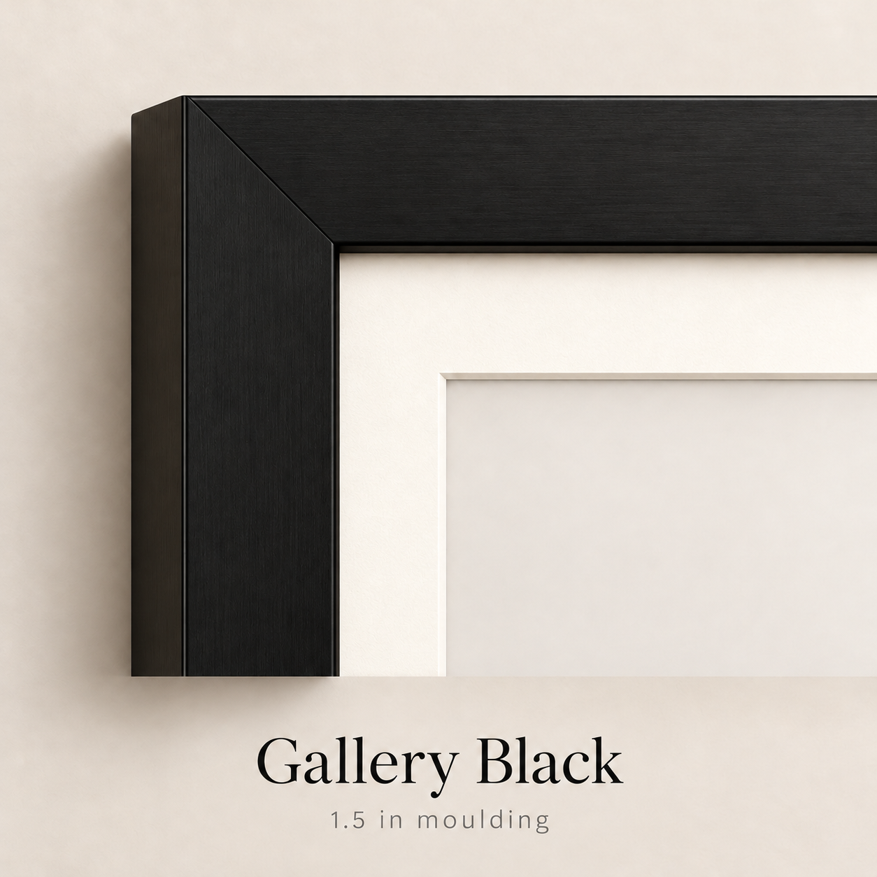 Close-up corner of a Gallery Black picture frame with 1.5 inch moulding and a white mat against a neutral beige wall.