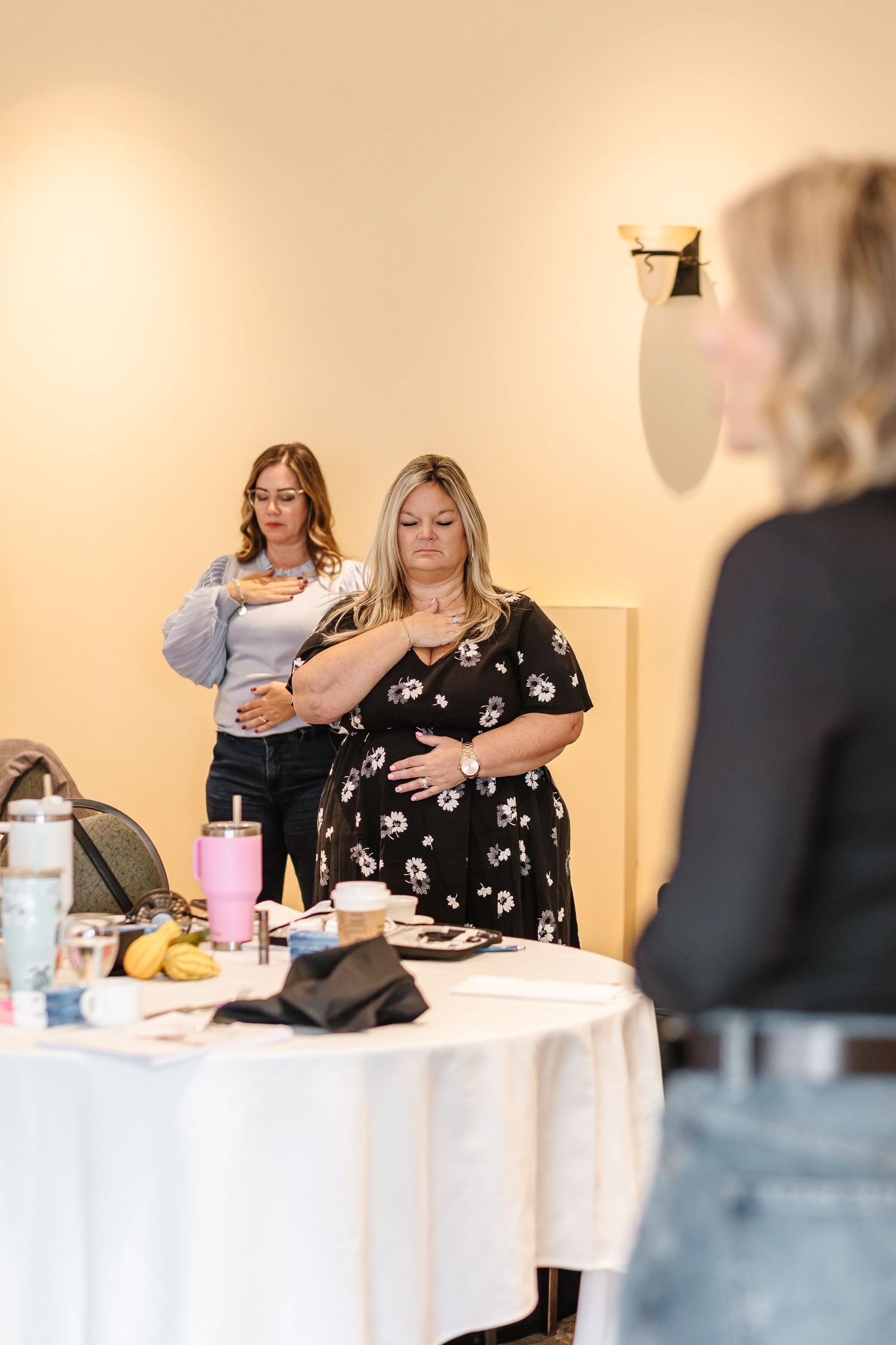 Candid shot of a group meditation at an event for a women's retreat at the watermark resort for the build your brave retreat