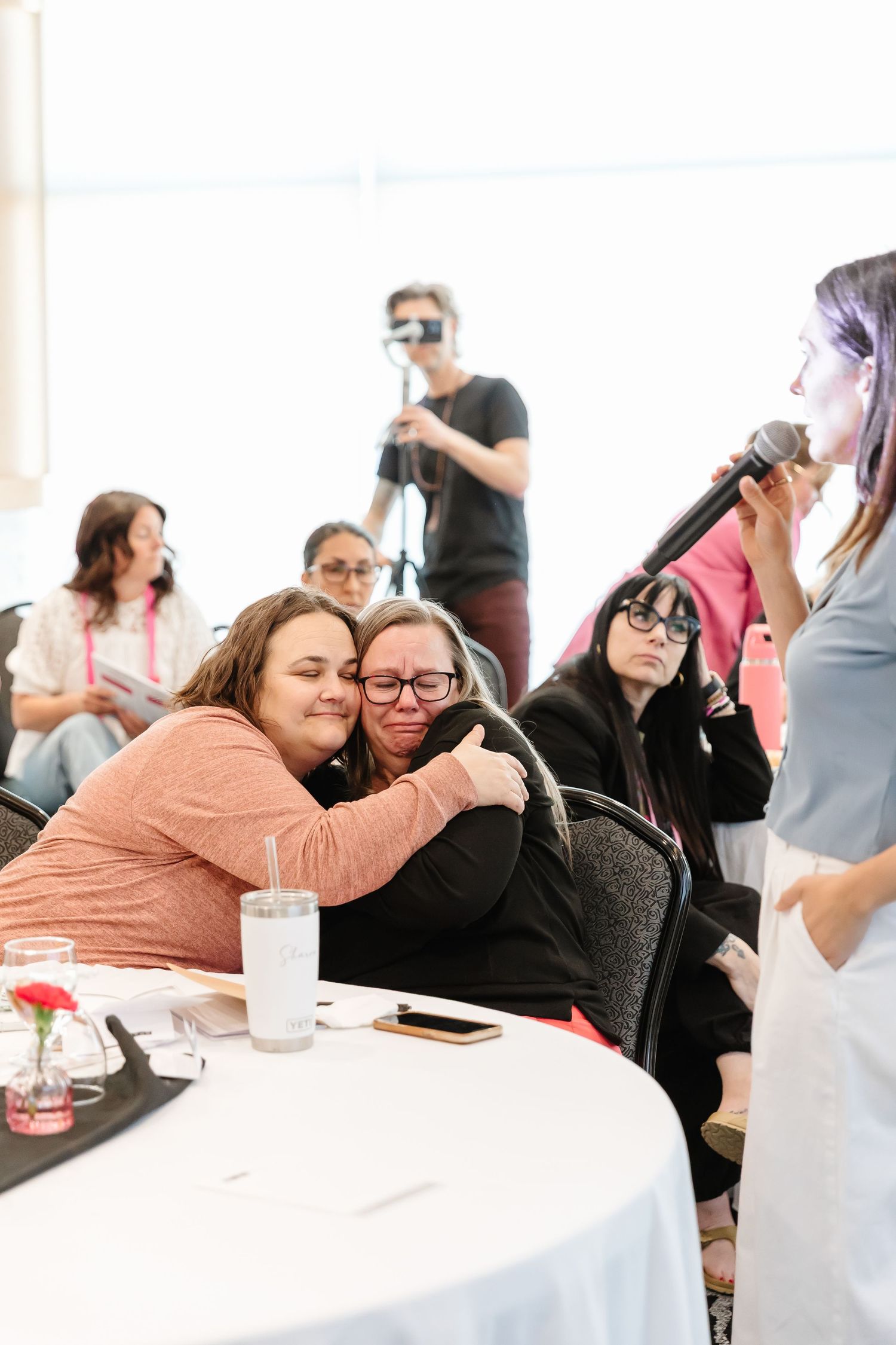 Emotional candid photo of event guests at the women's build your brave retreat located in Osoyoos bc, at the watermark resort