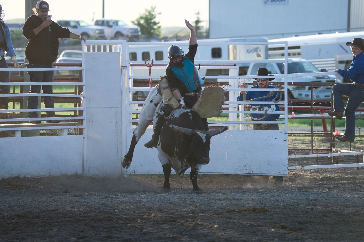 A sequence of action shots shows a rider being thrown from a bucking horse at a rodeo arena.