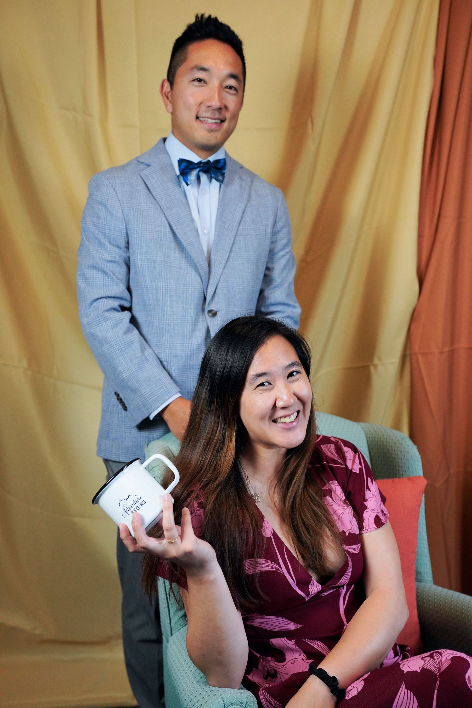 A candid series showing laughter and joy between two people in burgundy and gray attire against a gold curtain backdrop.
