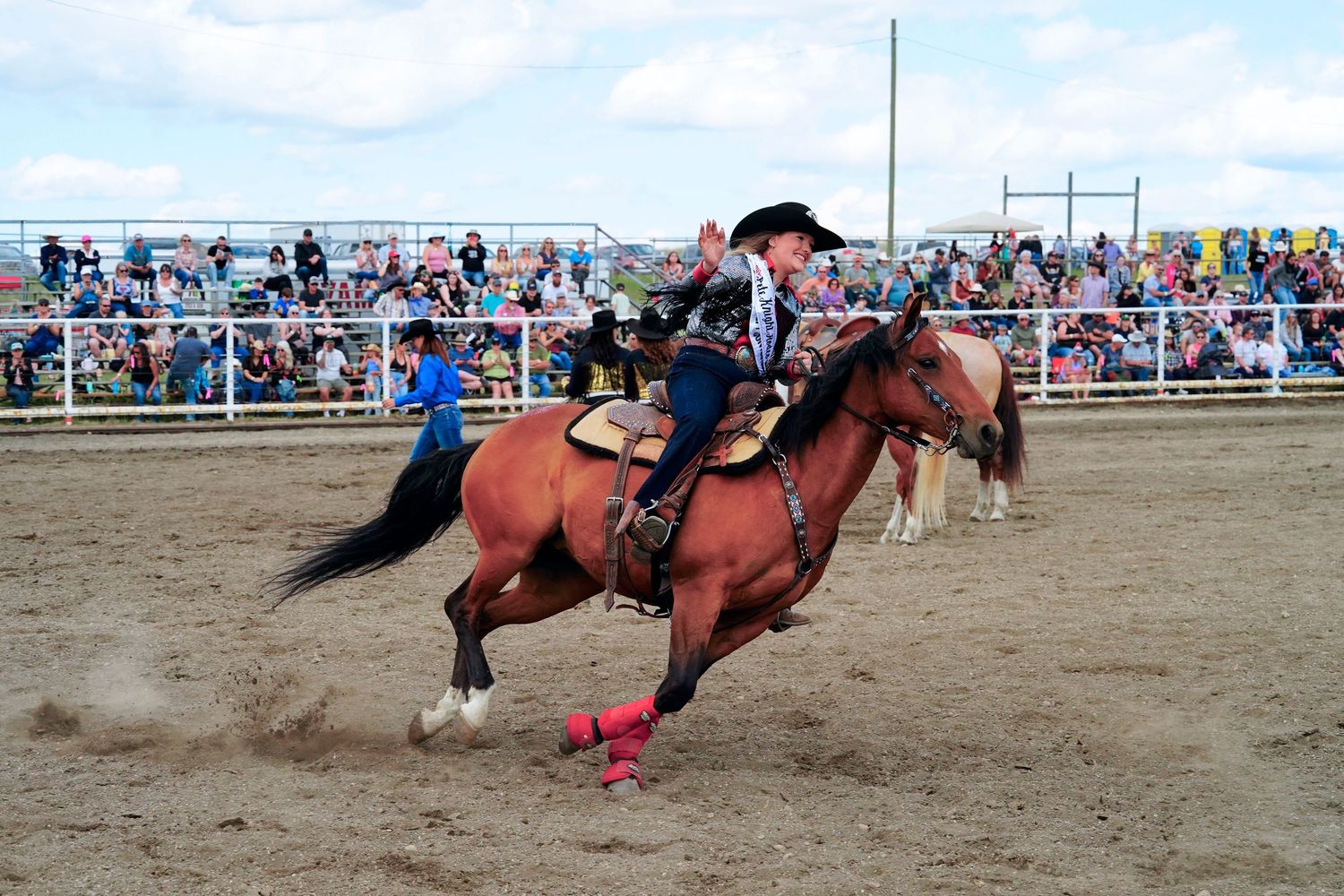 At a rodeo event, a series of action shots show a rider competing in a barrel racing competition on a brown horse.