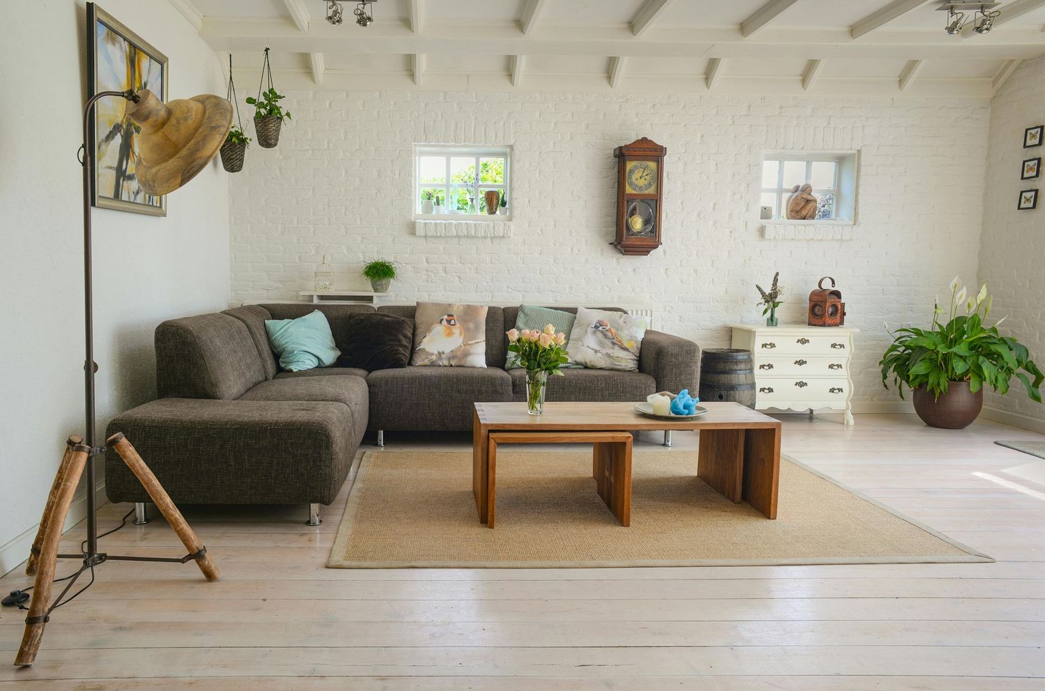 Bright and airy modern living room interior with light hardwood floors and minimalist Scandinavian decor.