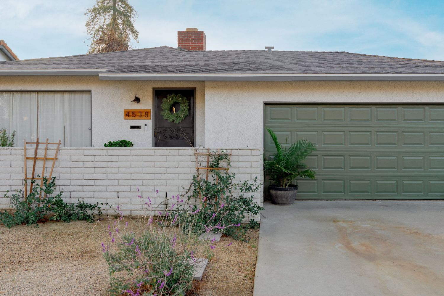 Collage of seven residential garage doors and driveways showing different styles and colors against house exteriors.