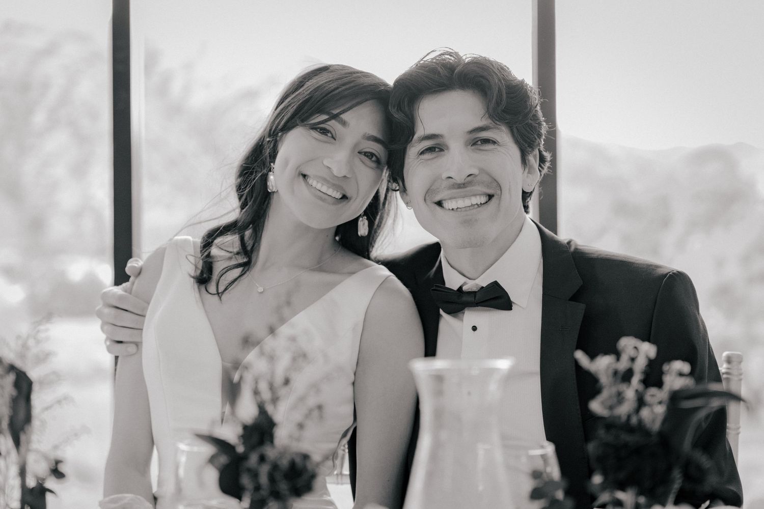 A series of black and white wedding photos showing happy couples and guests celebrating at an outdoor reception.