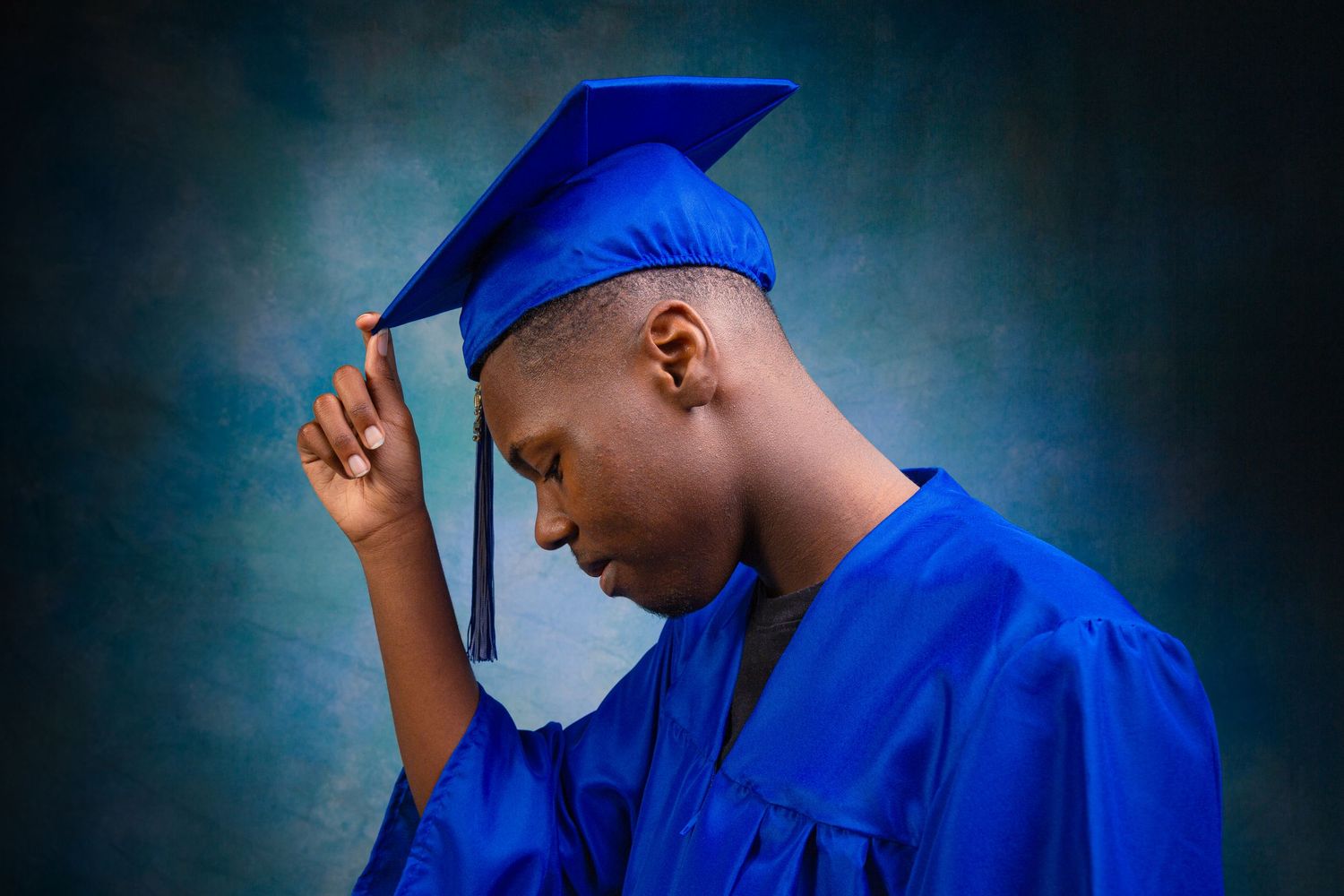 A graduate in blue cap and gown stands against a dark background in a series of expressive poses.