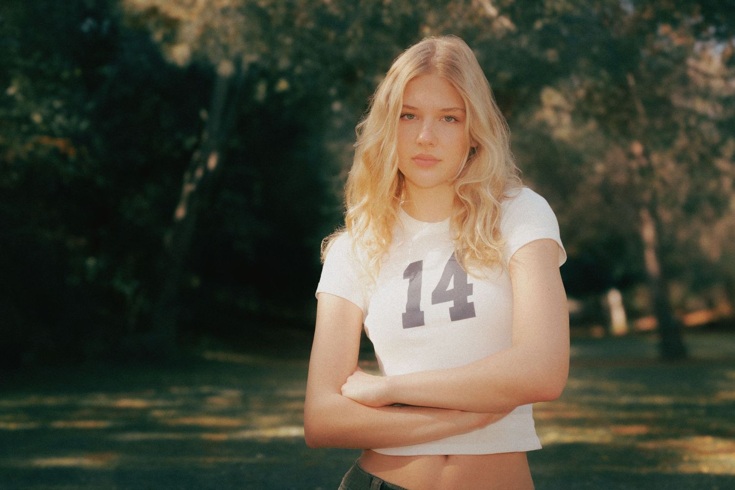 A series of outdoor portrait photographs showing someone in casual attire against a natural background.