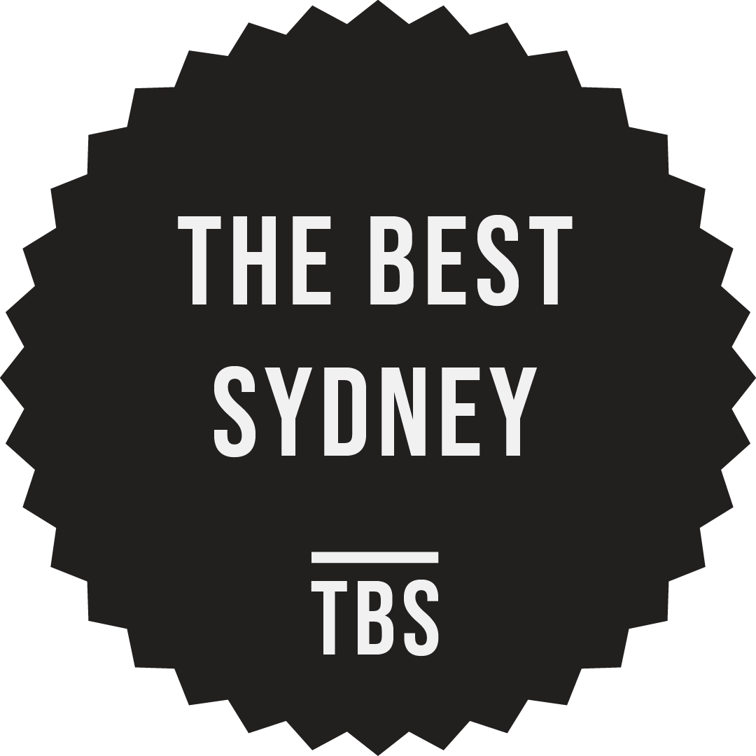 Black circular badge with white text reading 'THE BEST SYDNEY TBS' in capital letters.