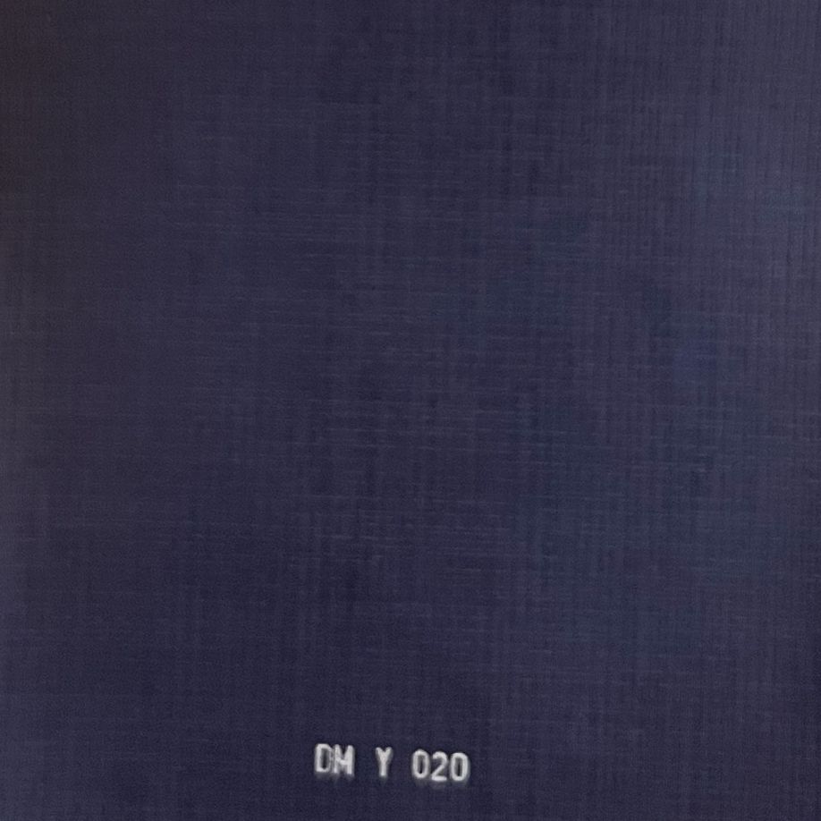 Navy blue linen fabric swatch with subtle texture, labeled DM Y 020.