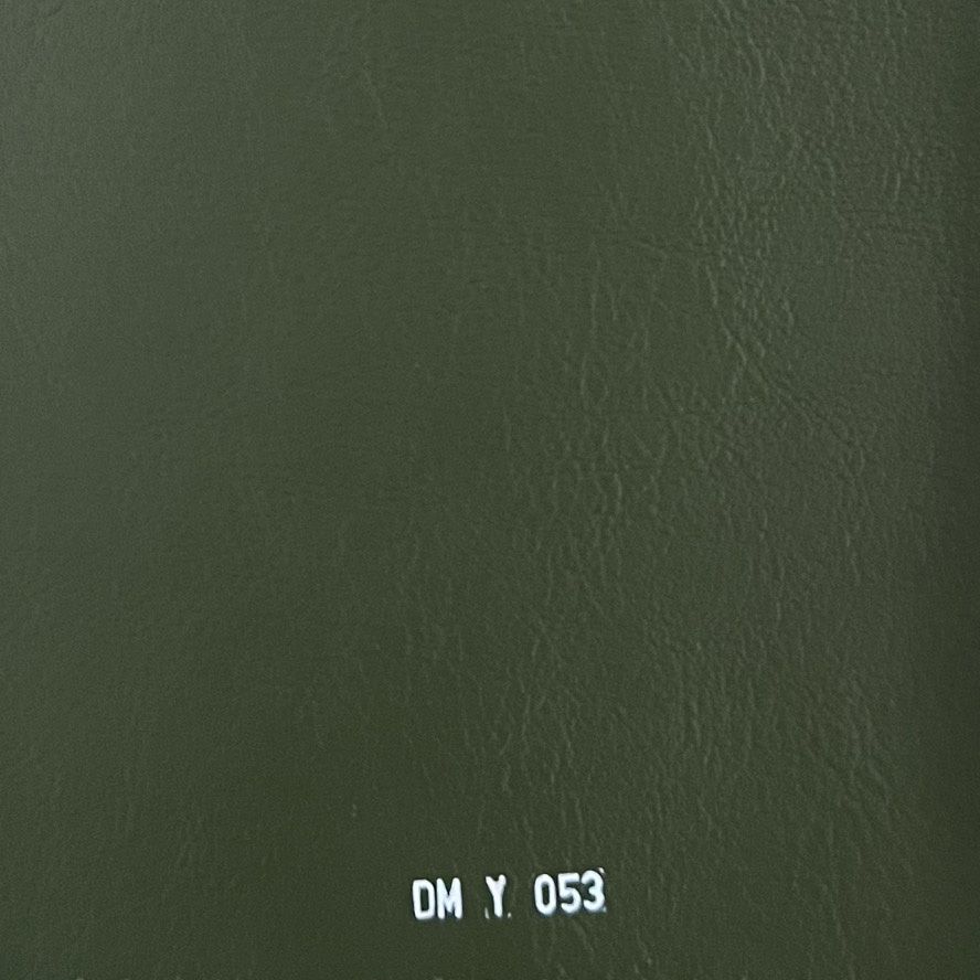 Dark olive green leather fabric swatch with smooth texture, labeled DM Y 053.