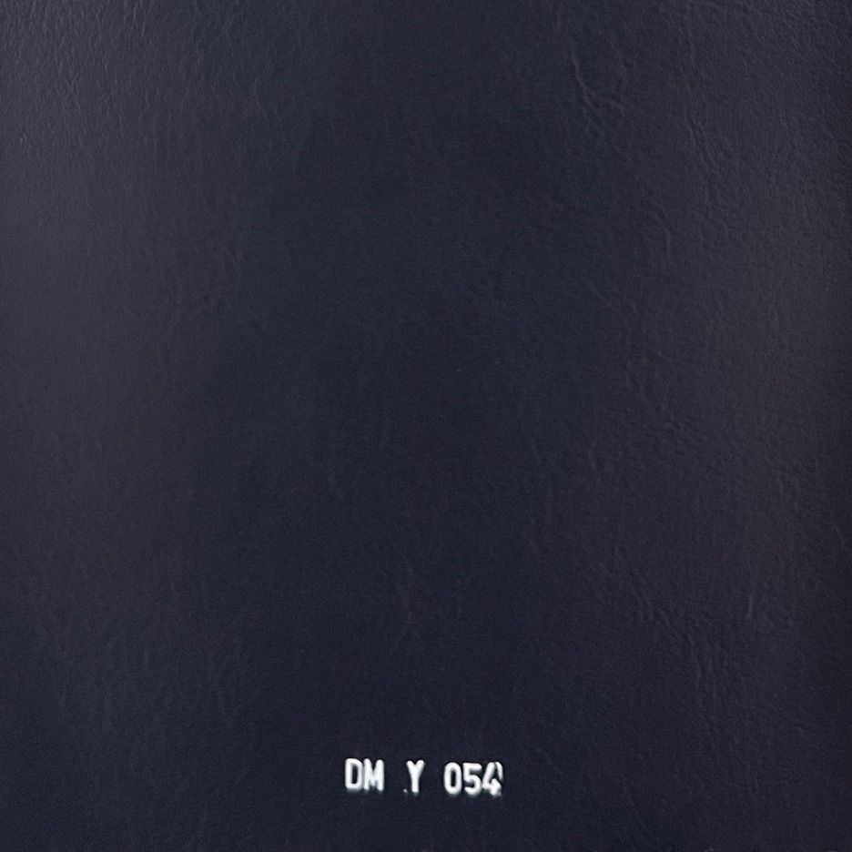 Dark navy leather fabric swatch with smooth texture, labeled DM Y 054.