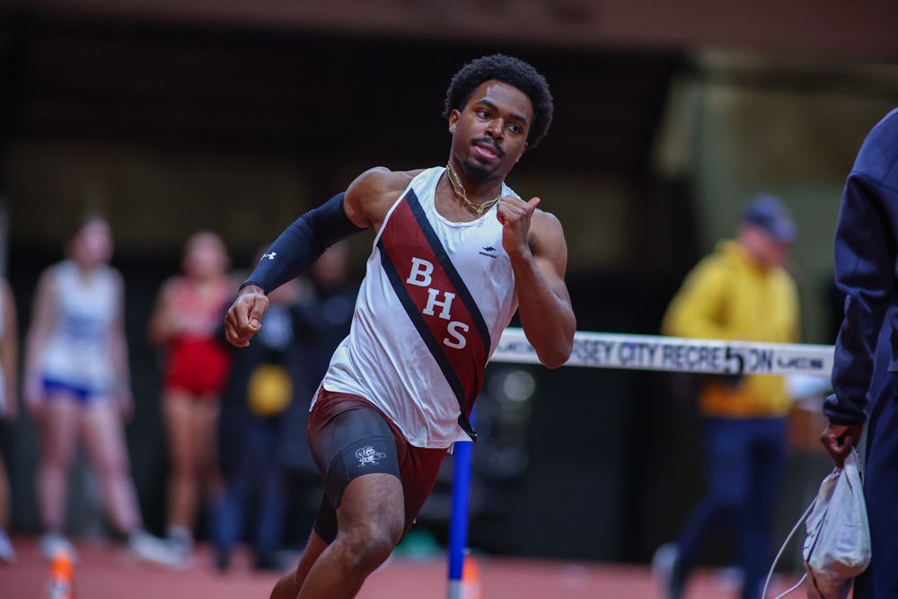BHS track athlete sprinting at indoor track meet at Jersey City Recreation Center.