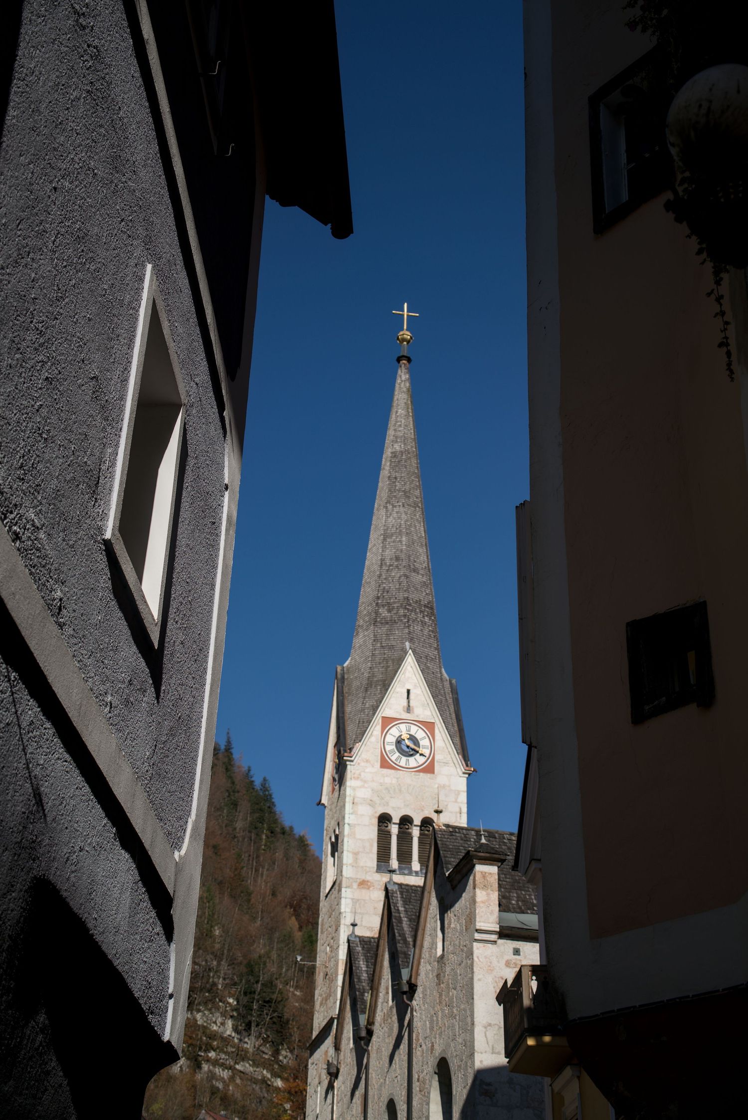 Mountain church between buildings