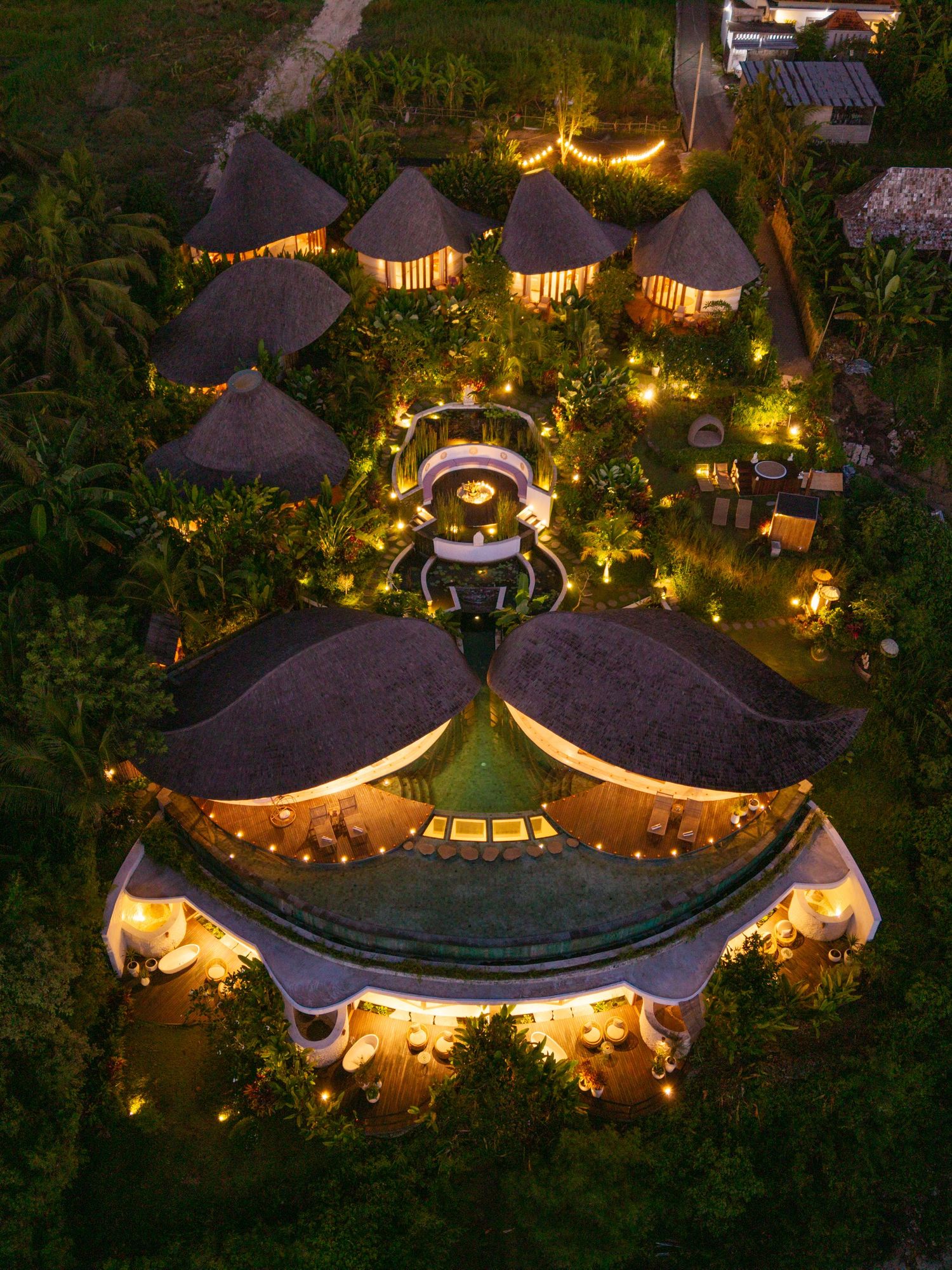 Solana Ubud retreat venue illuminated at night in Bali