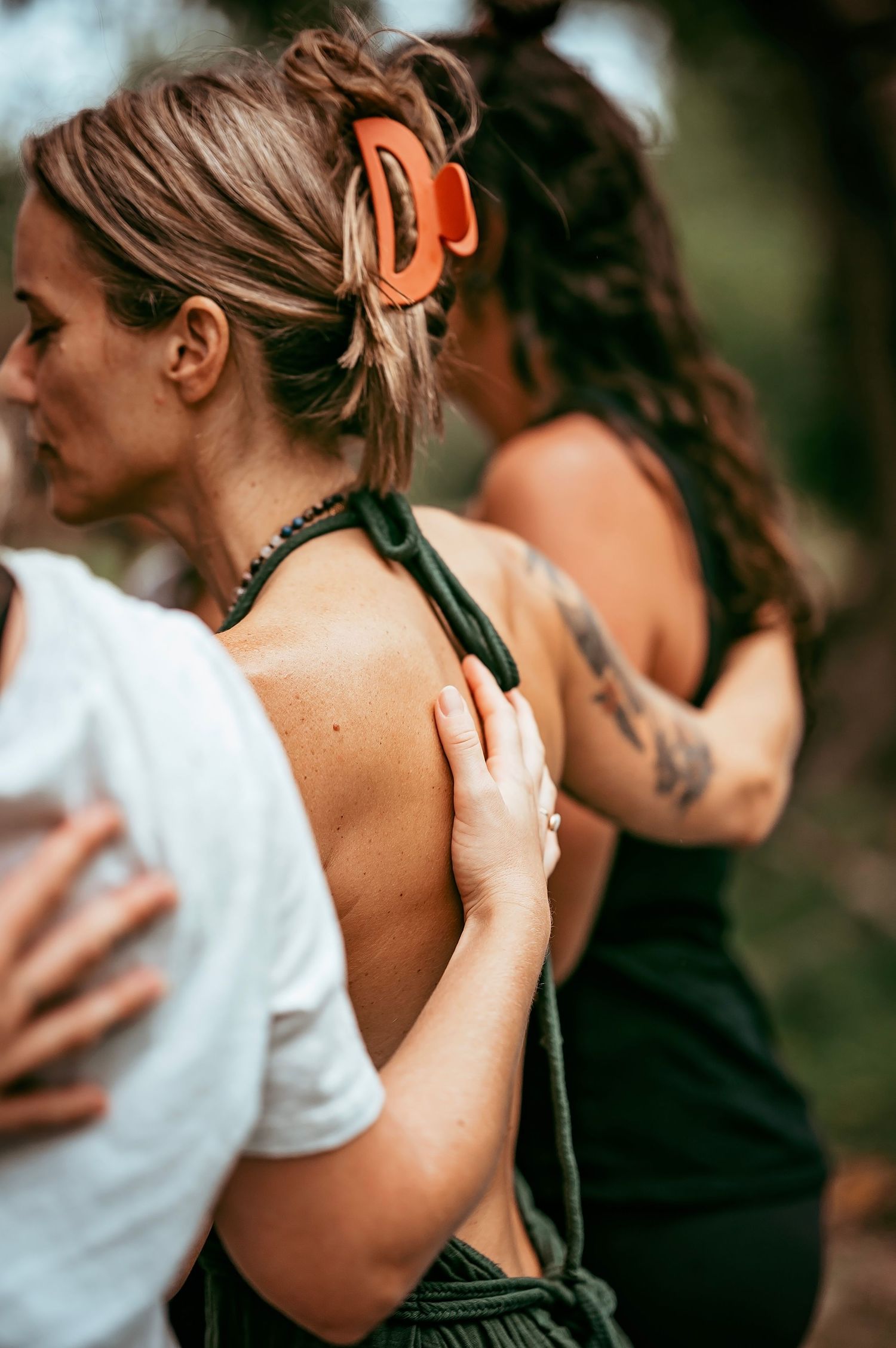Close-up of connection during a yoga and breathwork gathering with Ali Mayfield