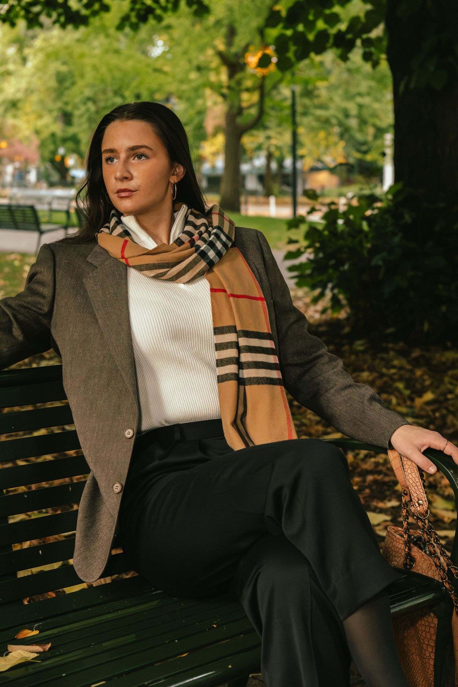 Fall golden hour photoshoot professional woman sitting on bench downtown park portrait Gwyn Wallace Photography Portland Oregon photographer