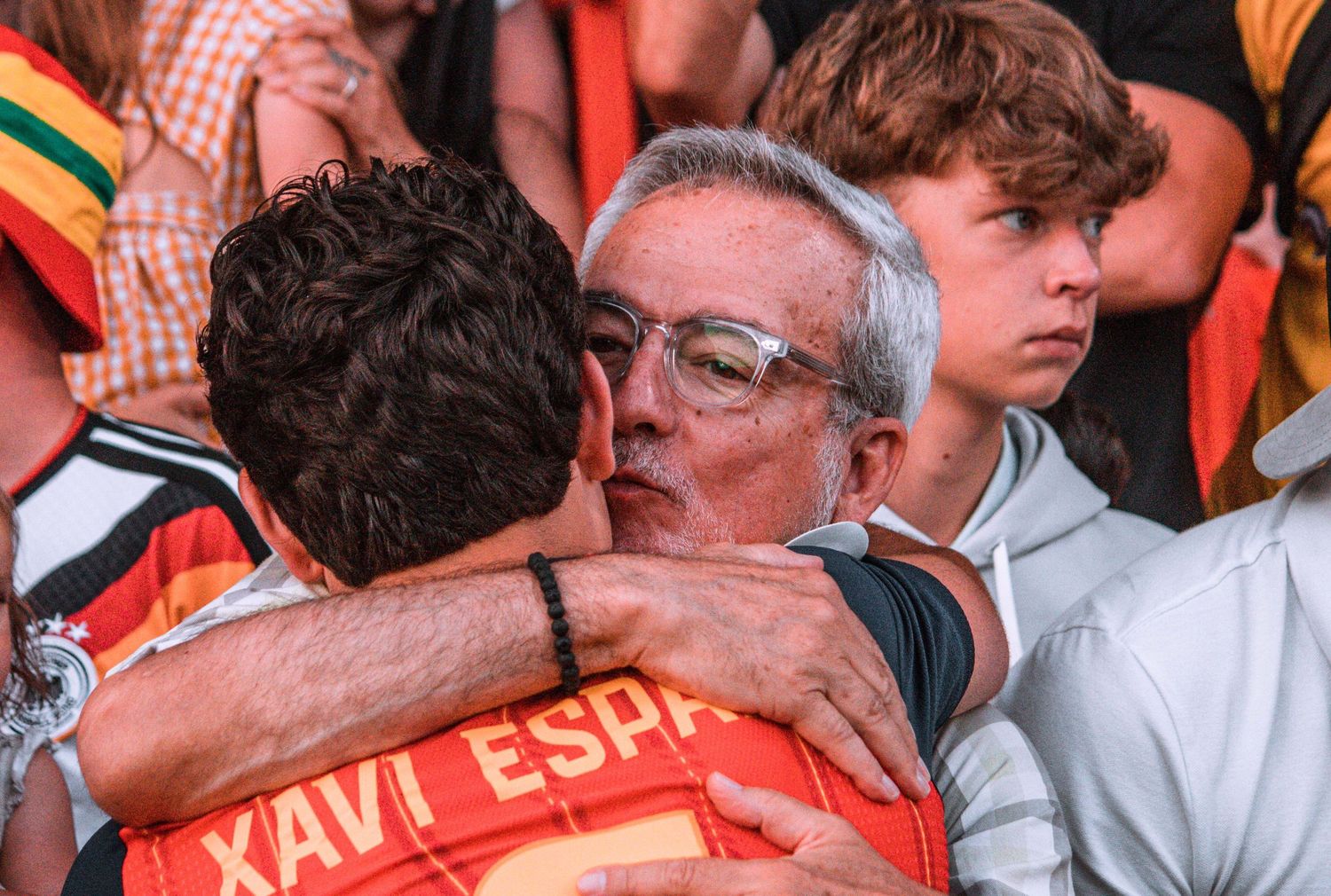 a father and son sharing a moment after winnig the euros