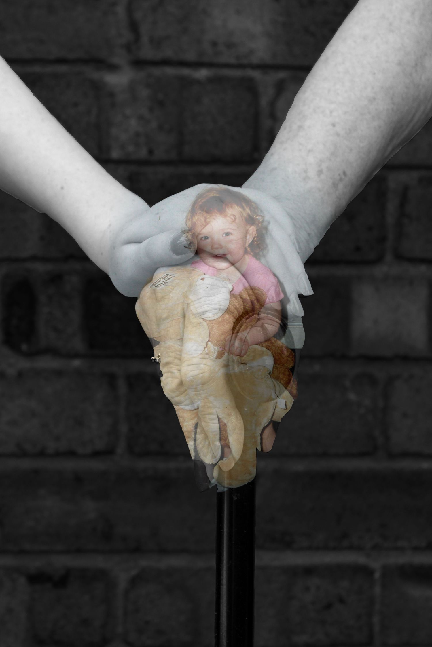 A grandparent and grandchild holding hands. Black and white. A photo of a the grandchild holding teddies is overlayed.
