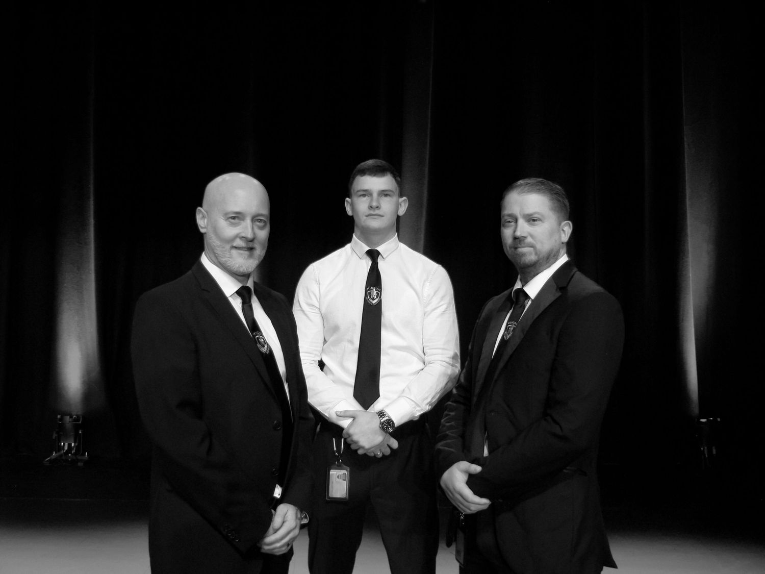 Portrait of three security guards for Hinson Security Services. Black and white.