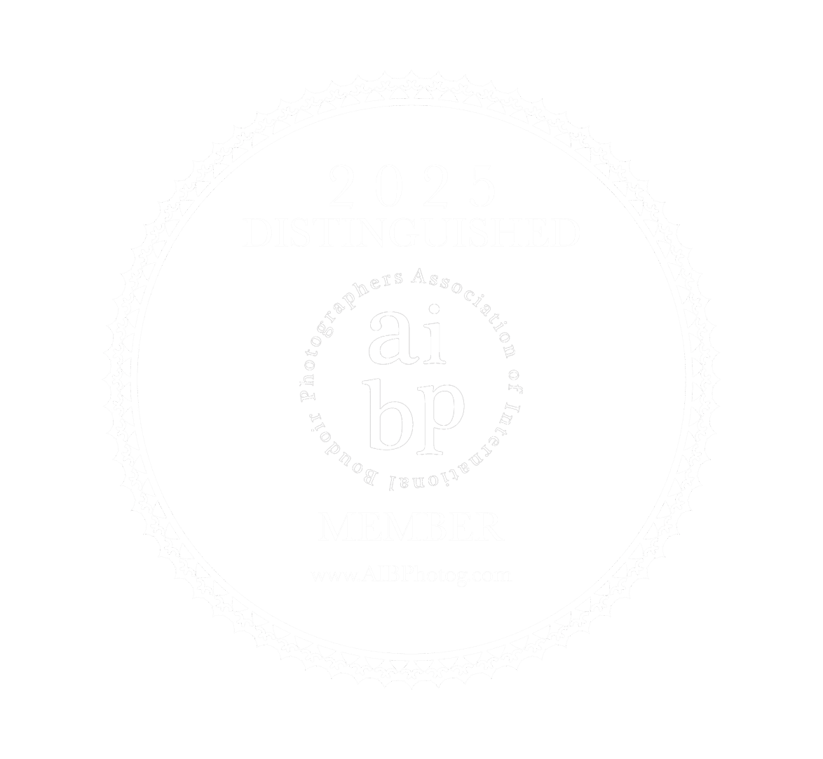 A faint circular watermark or logo design appears on a white background.
