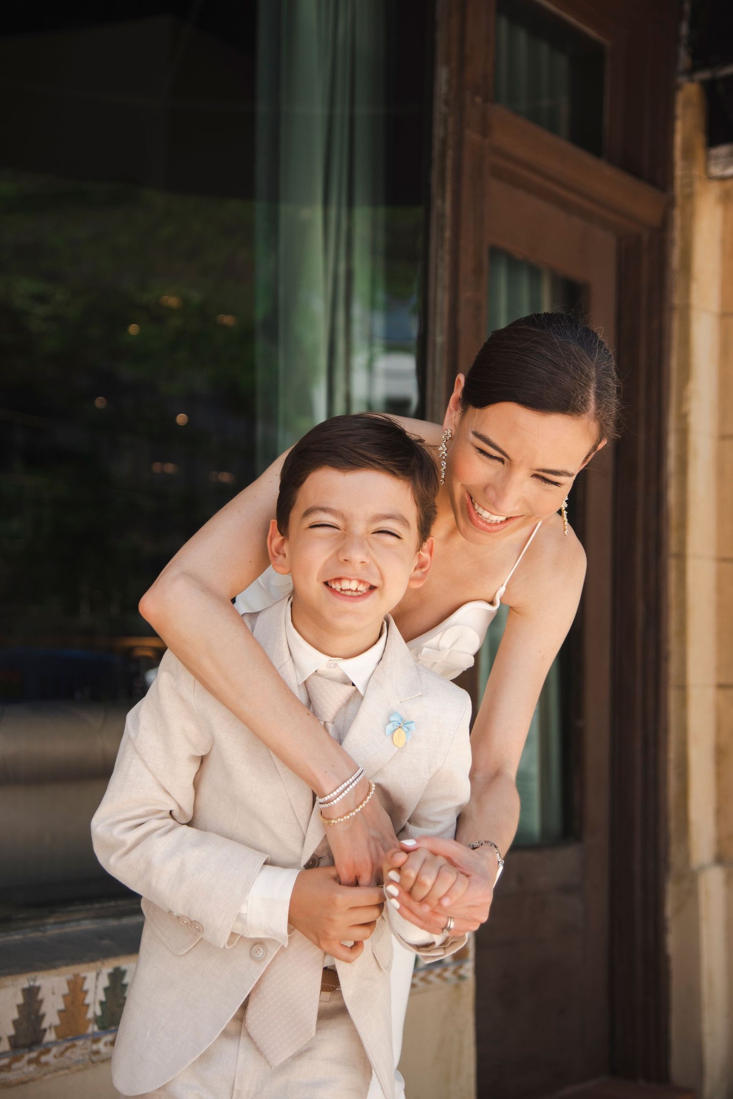 Candid moments captured during a wedding celebration in formal attire.