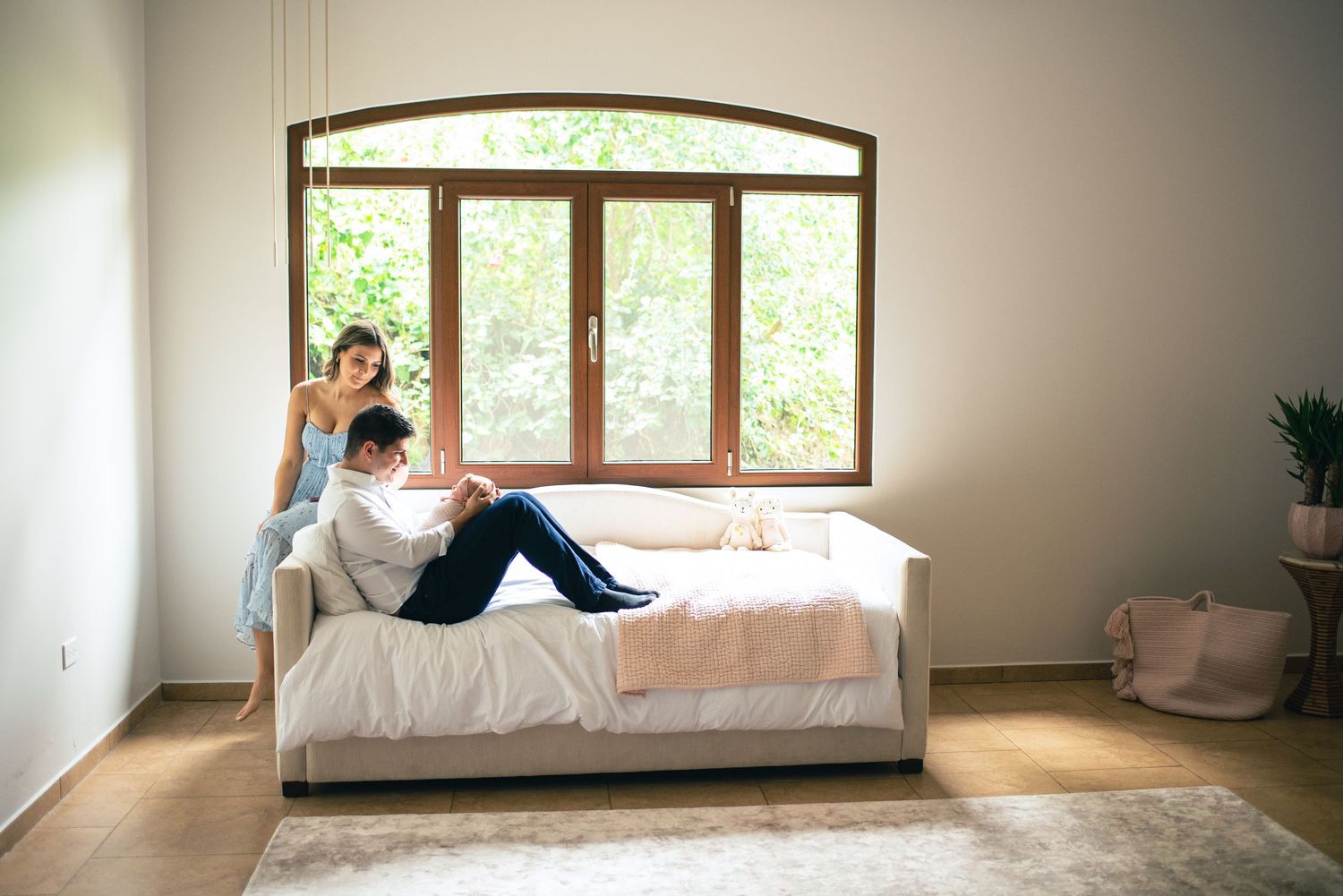 A series of connected images showing a bright, minimalist interior space with natural light streaming through windows.