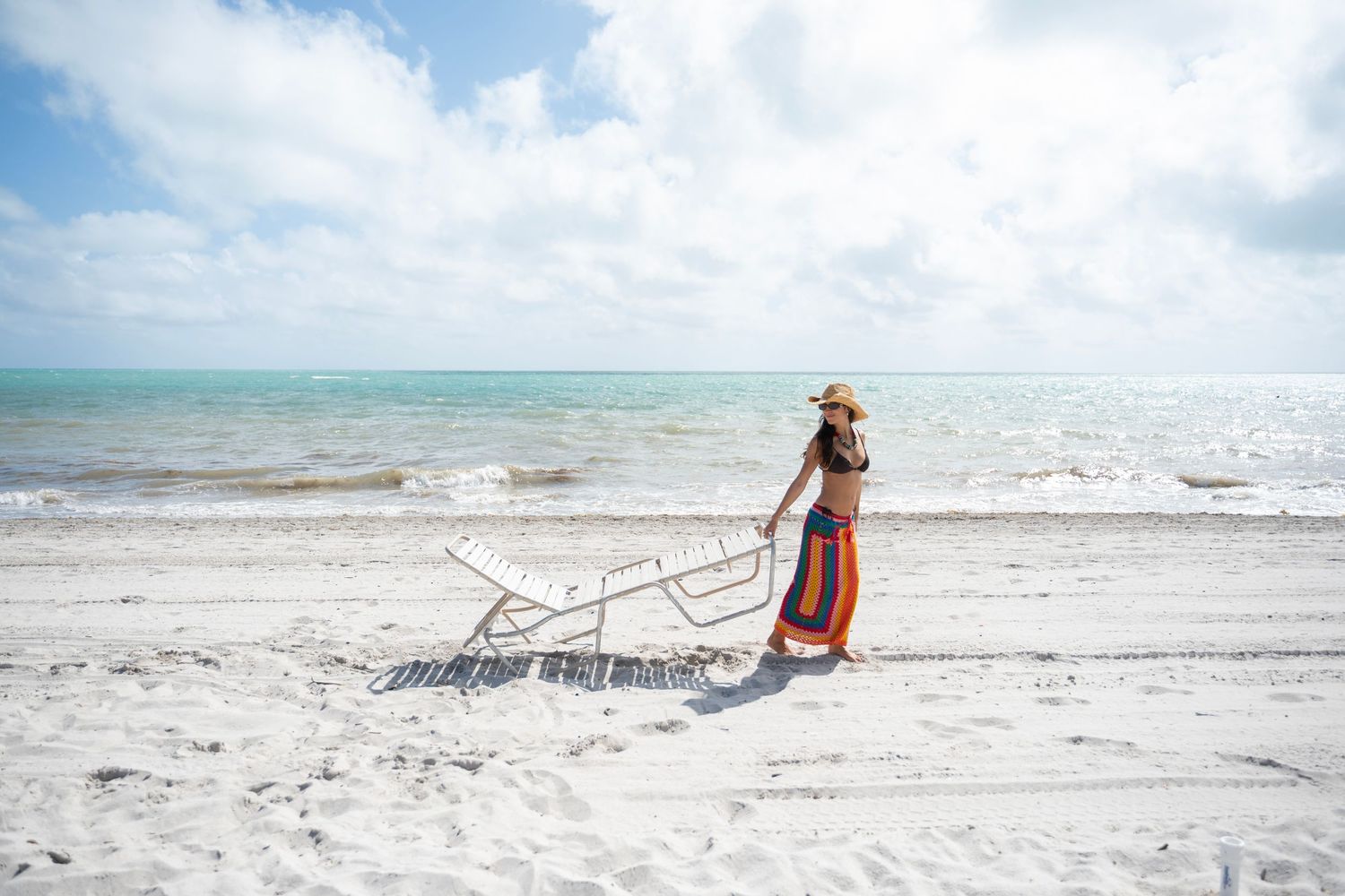 A series of serene beach scenes showing white sand, turquoise waters, and coastal landscapes under cloudy skies.