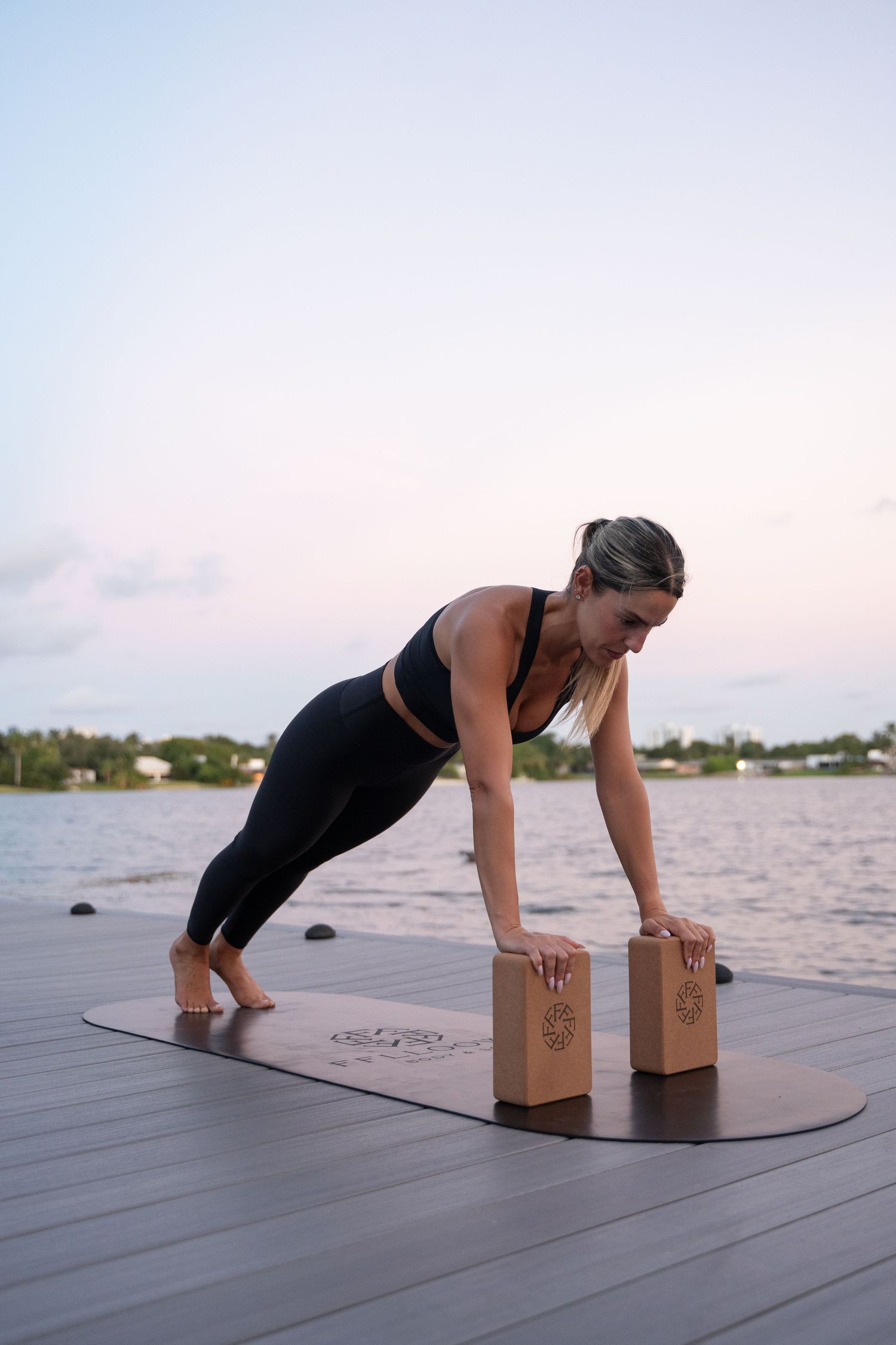 Exercise sequence using wooden blocks for support on outdoor deck.
