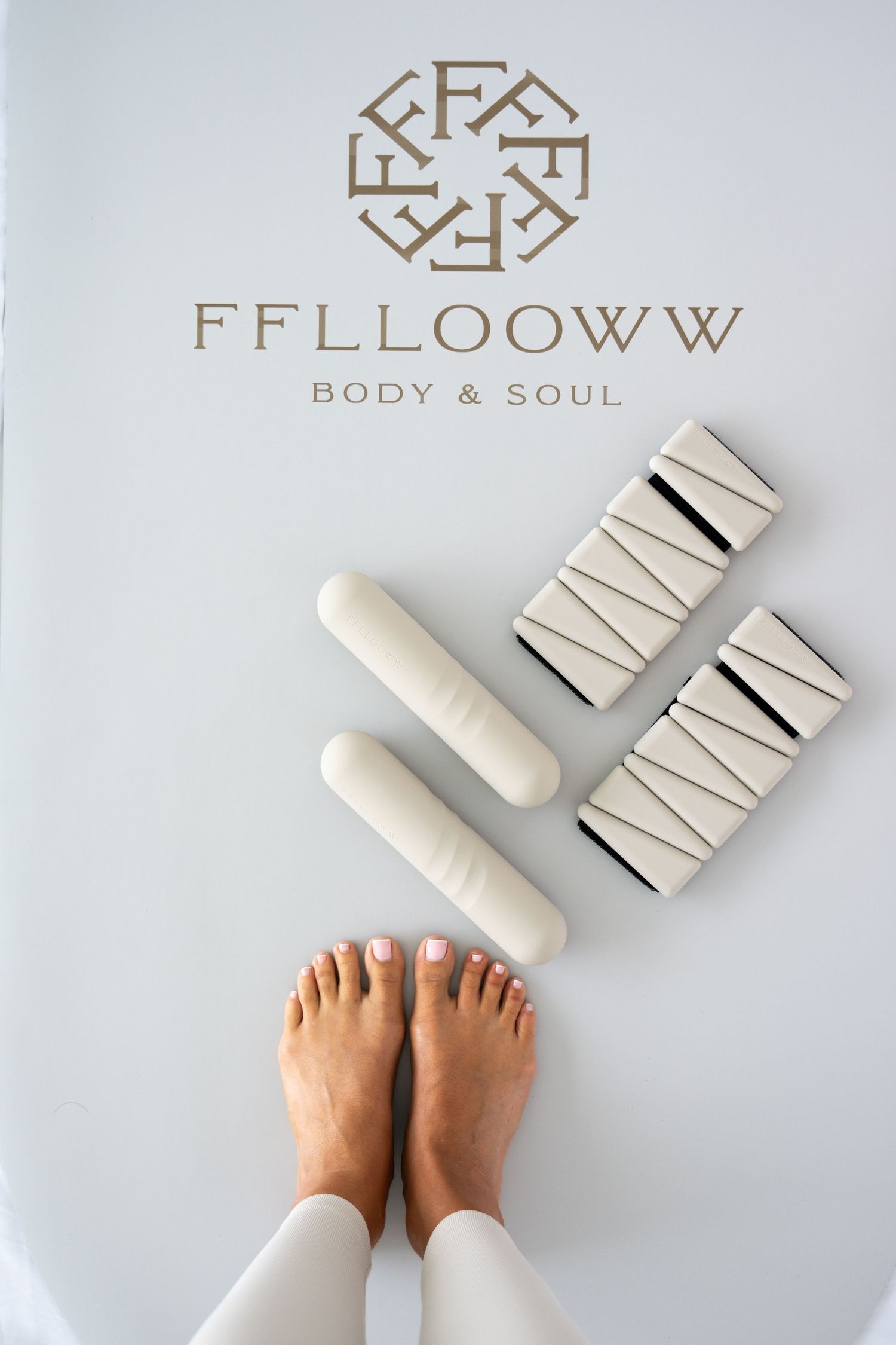 FFLLOWW brand logo with yoga blocks and feet on white background.