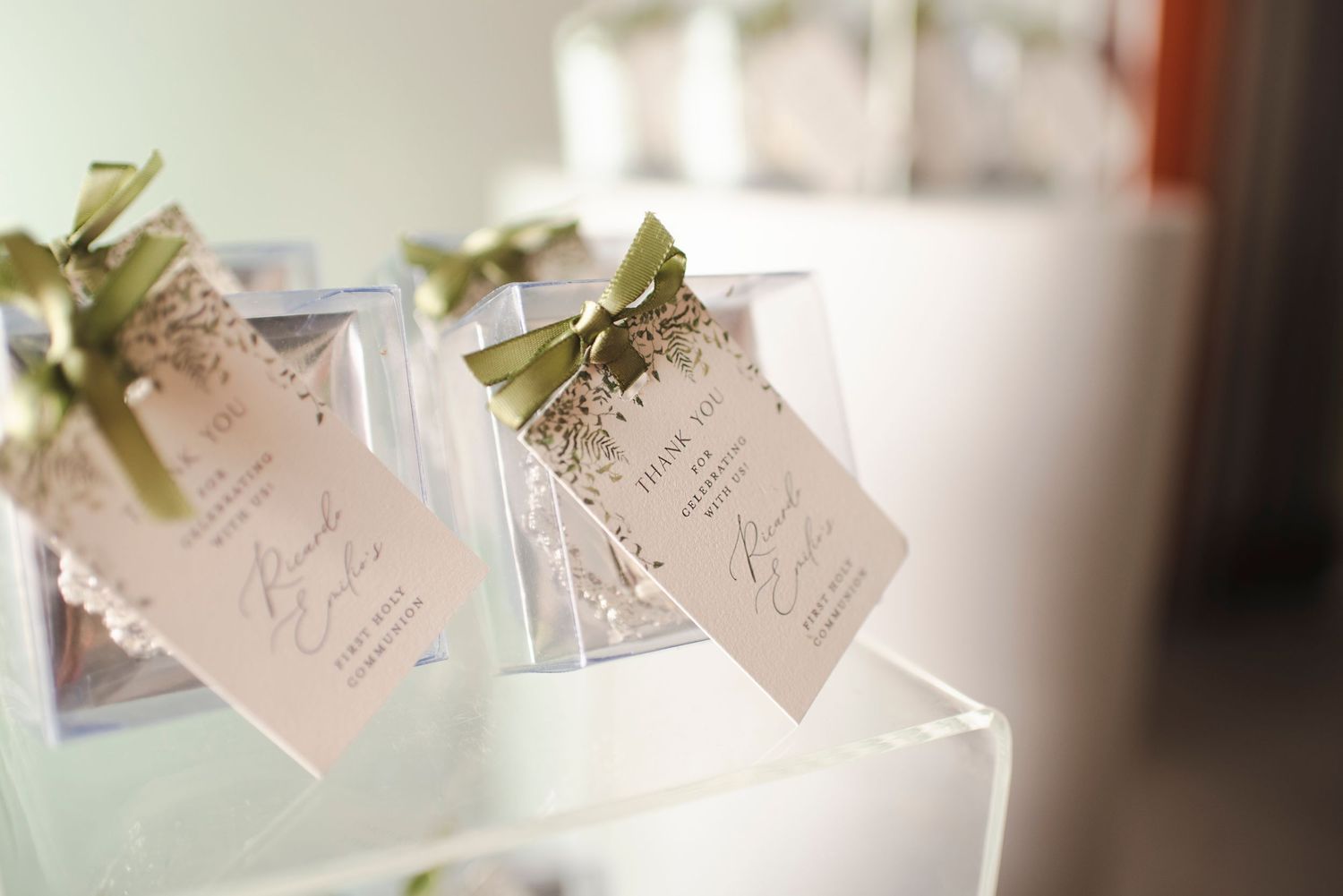 Delicate paper name cards with floral accents arranged for special event.