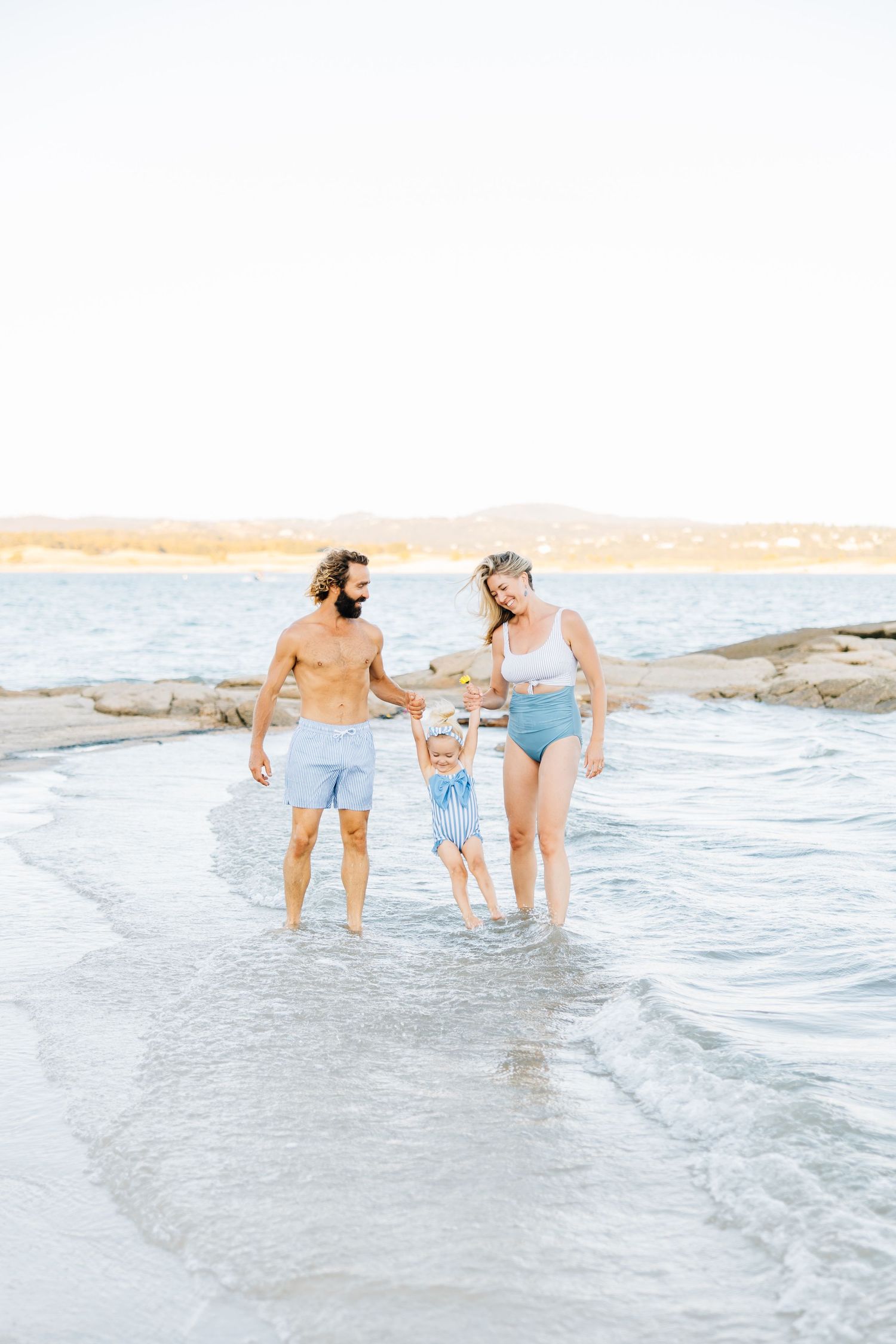 Golden sands, gentle waves, and laughter—this beach session captures authentic family connection and the beauty of moments together.
