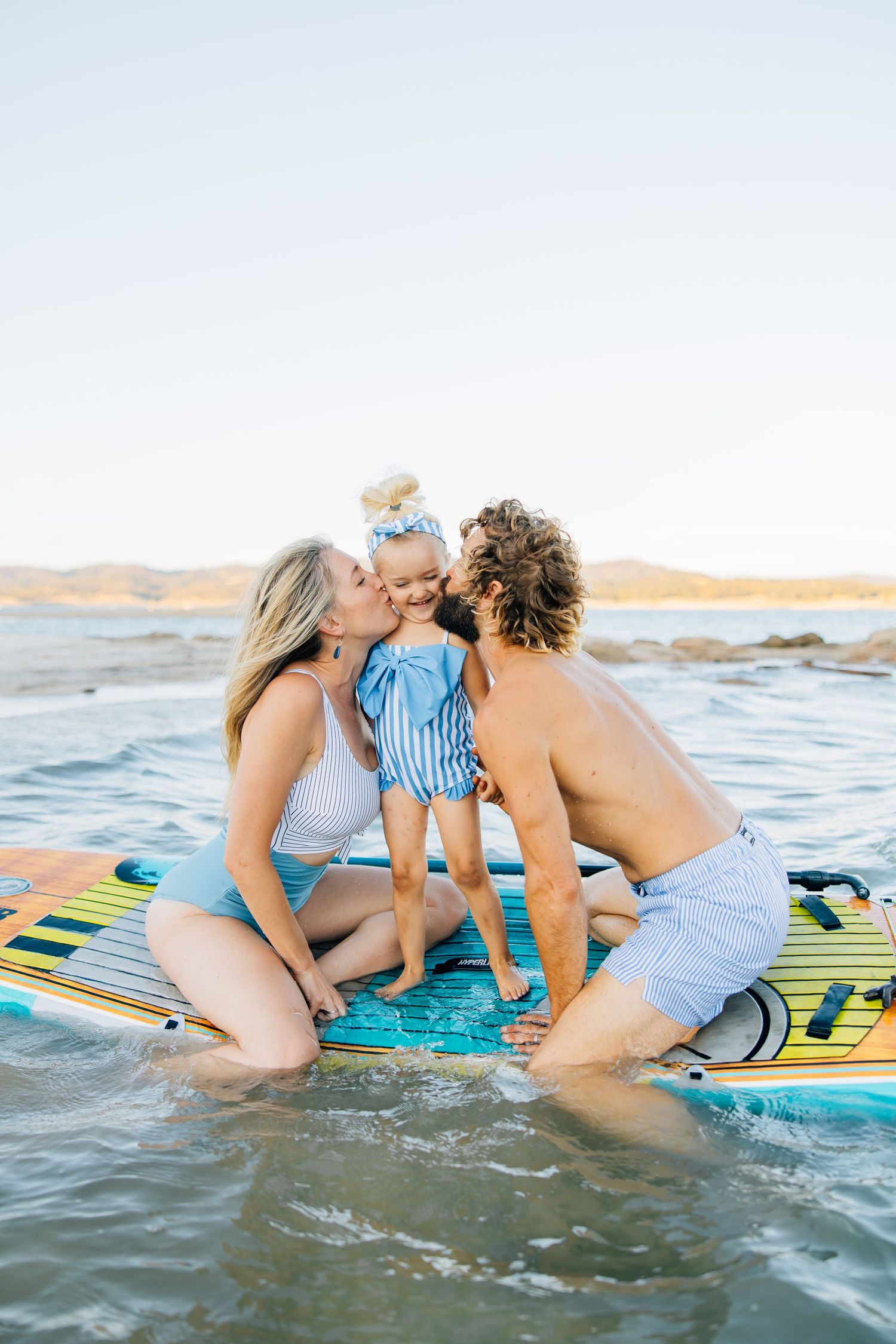 Golden sands, gentle waves, and laughter—this beach session captures authentic family connection and the beauty of moments together.