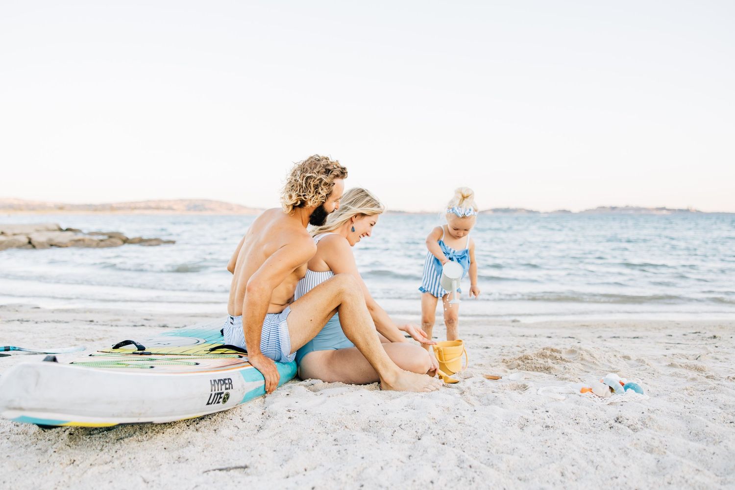 Golden sands, gentle waves, and laughter—this beach session captures authentic family connection and the beauty of moments together.