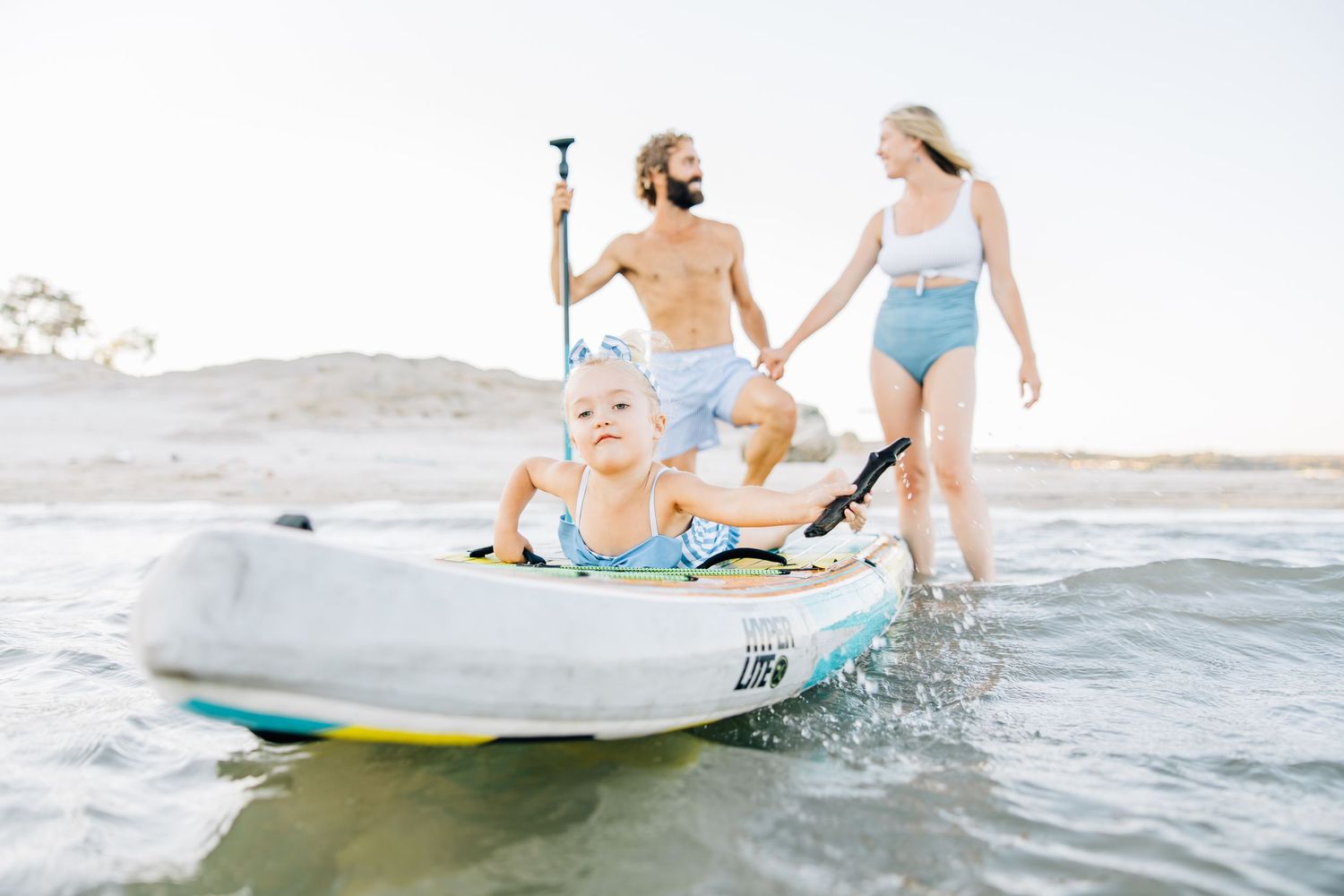 Golden sands, gentle waves, and laughter—this beach session captures authentic family connection and the beauty of moments together.