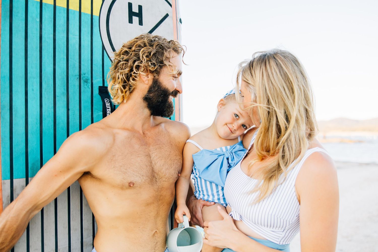 Golden sands, gentle waves, and laughter—this beach session captures authentic family connection and the beauty of moments together.