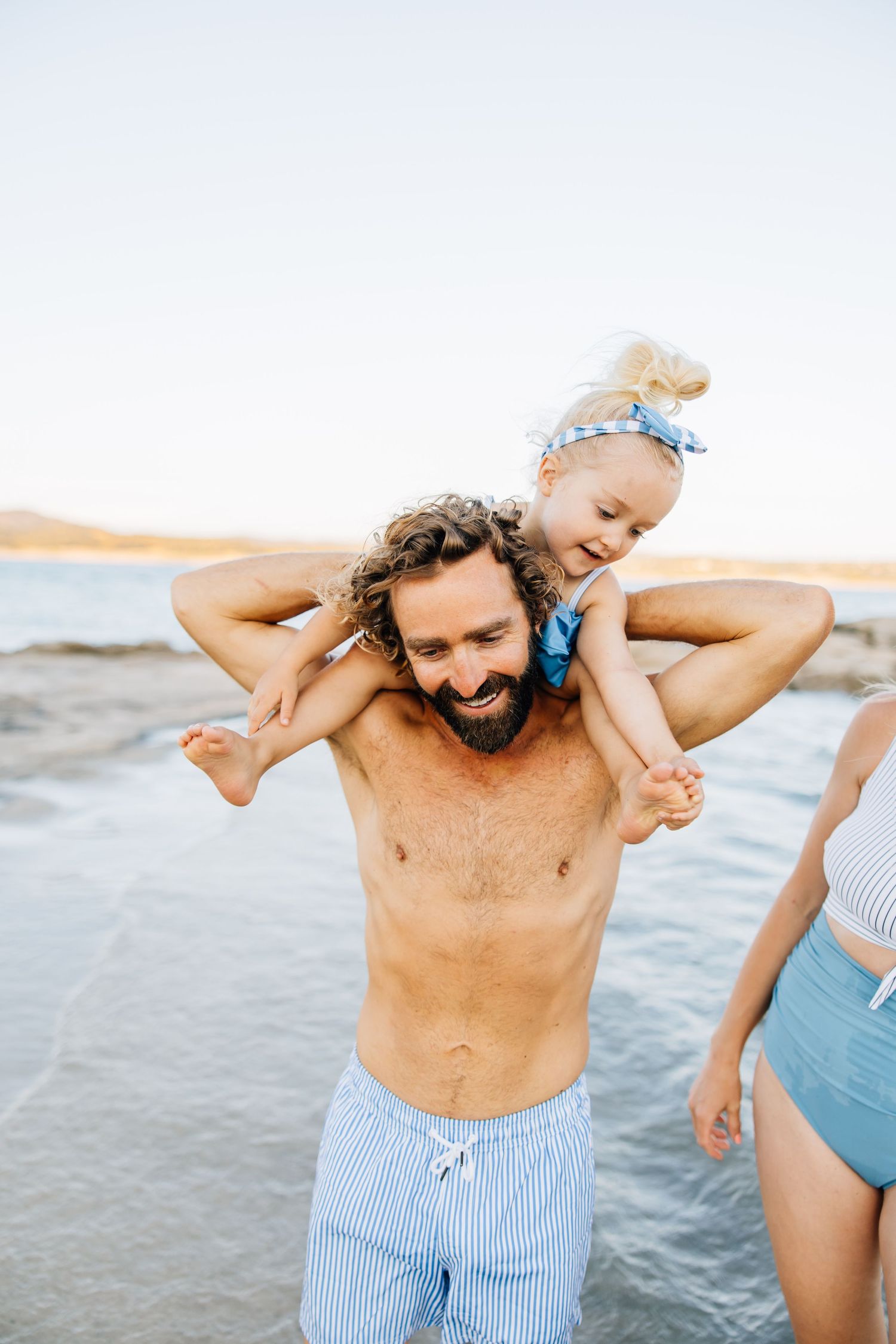 Golden sands, gentle waves, and laughter—this beach session captures authentic family connection and the beauty of moments together.