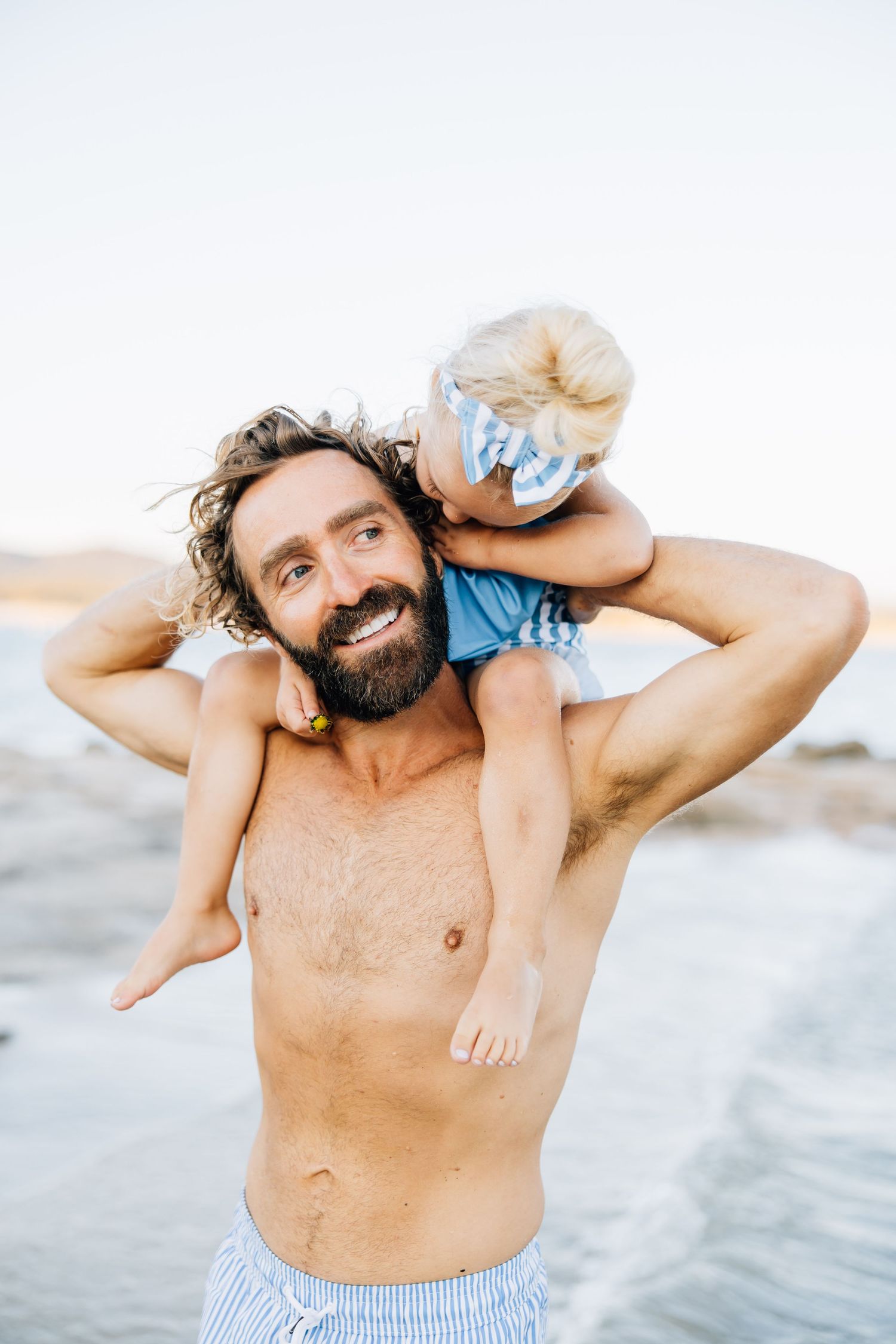 Golden sands, gentle waves, and laughter—this beach session captures authentic family connection and the beauty of moments together.