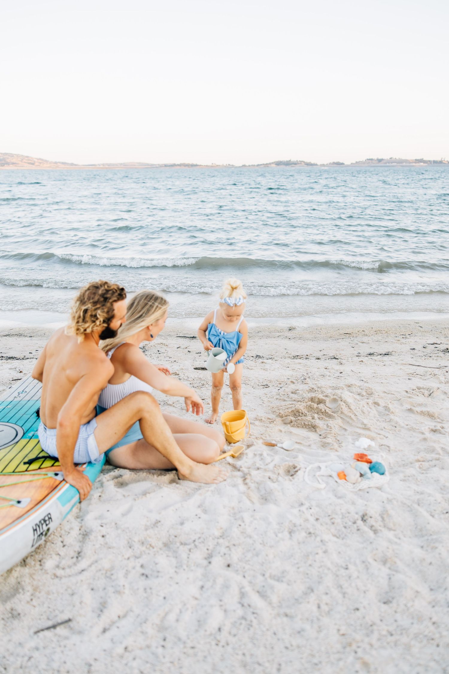Golden sands, gentle waves, and laughter—this beach session captures authentic family connection and the beauty of moments together.