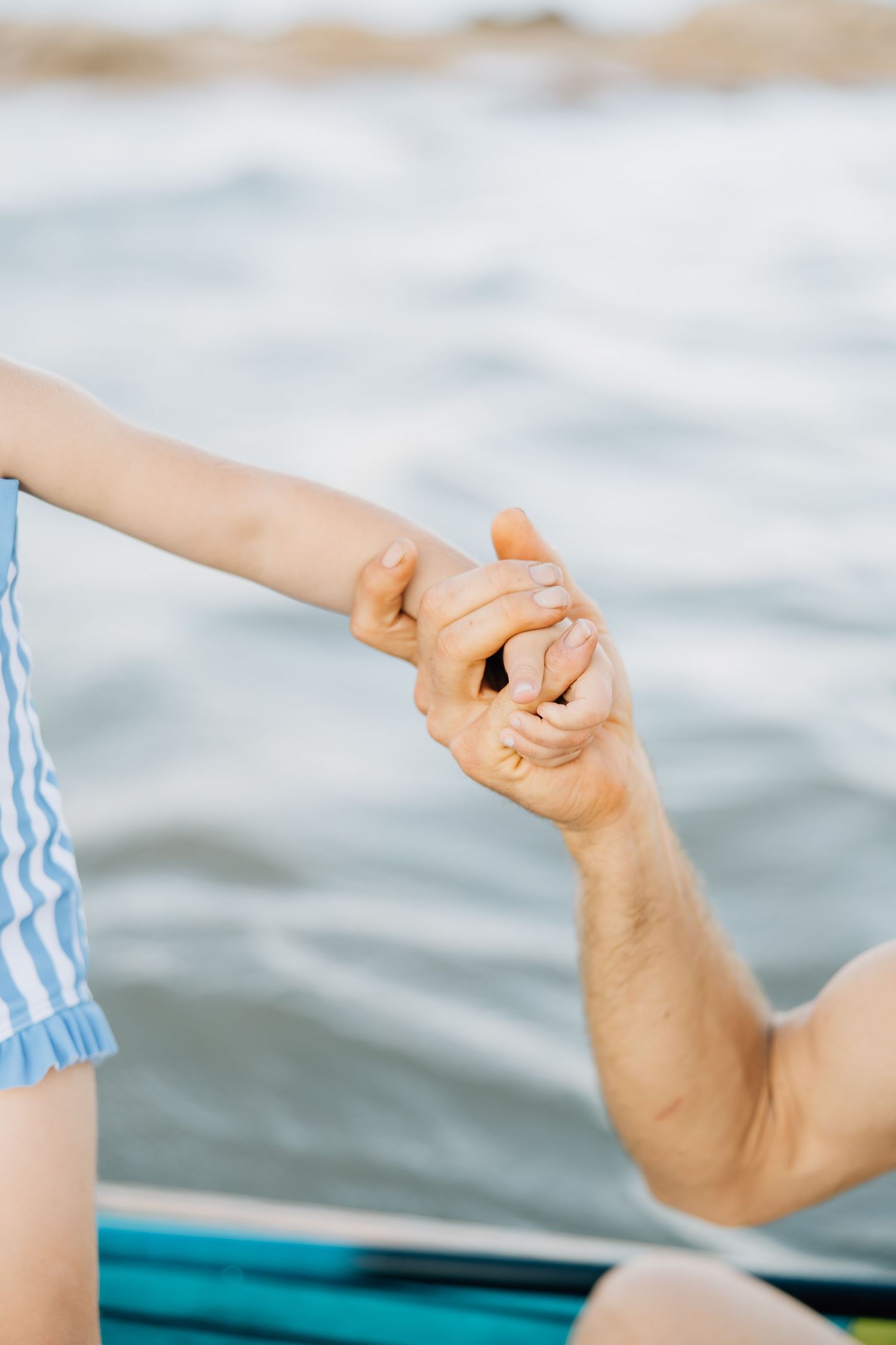 Golden sands, gentle waves, and laughter—this beach session captures authentic family connection and the beauty of moments together.