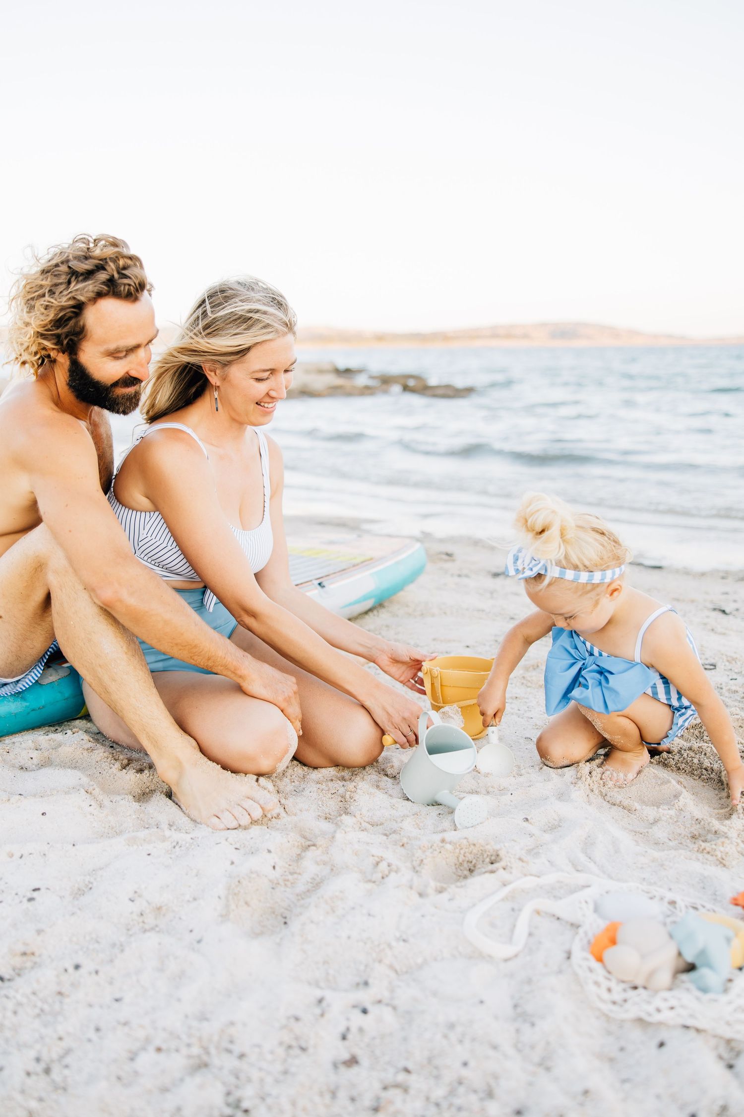 Golden sands, gentle waves, and laughter—this beach session captures authentic family connection and the beauty of moments together.