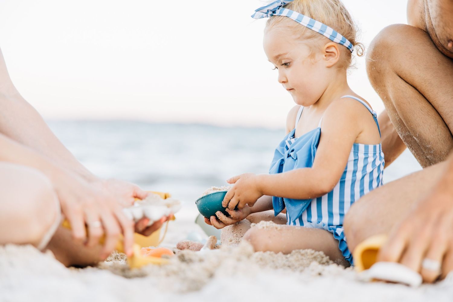 Golden sands, gentle waves, and laughter—this beach session captures authentic family connection and the beauty of moments together.